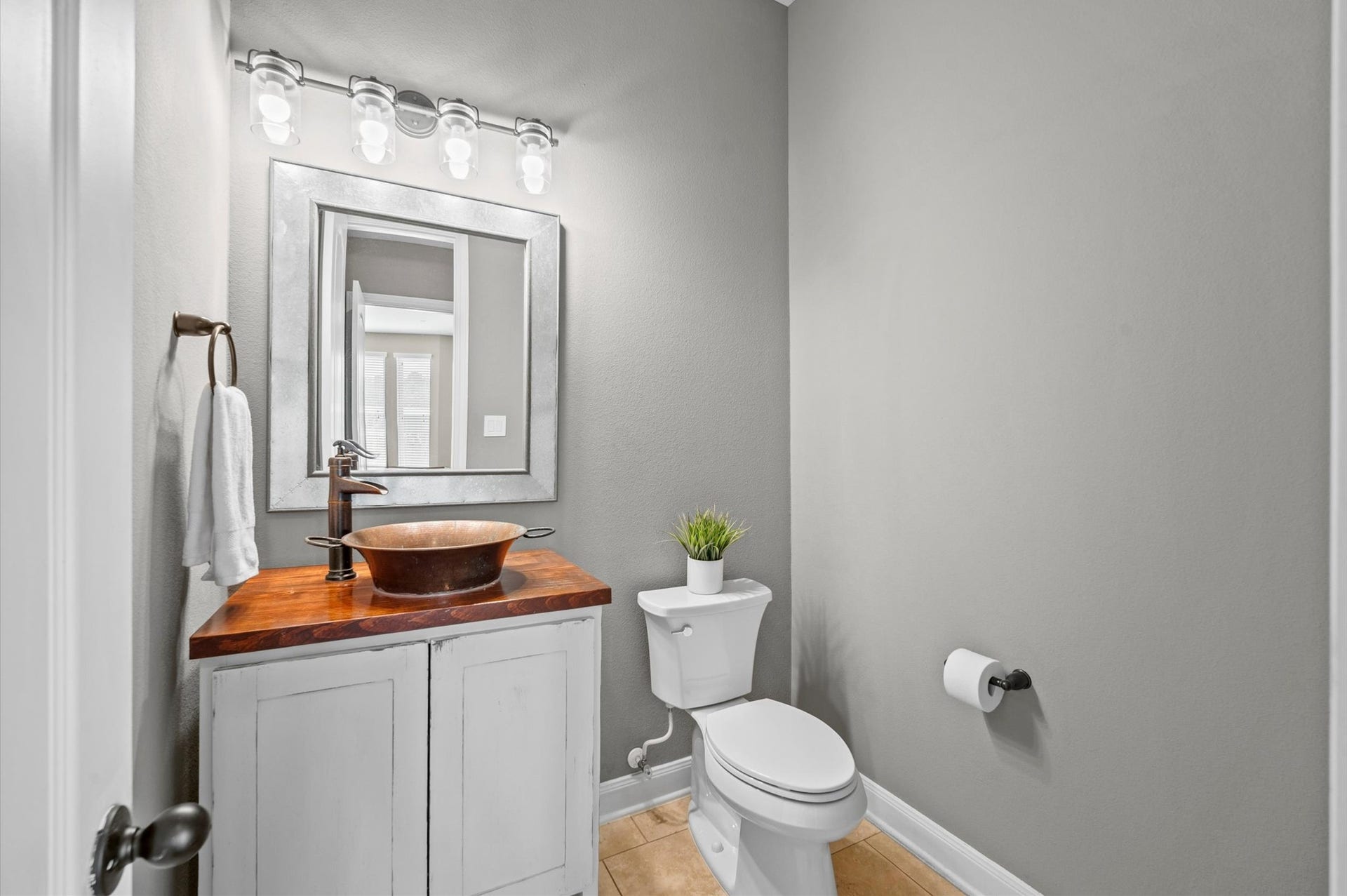 24611 Waterstone Estates Circle S, Tomball, TX 77375 This convenient half bath is located near the flex space and media room.