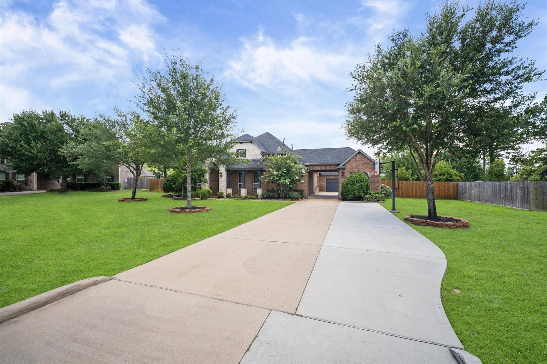 24611 Waterstone Estates Circle S, Tomball, TX 77375 There are plenty of spaces for multiple cars.