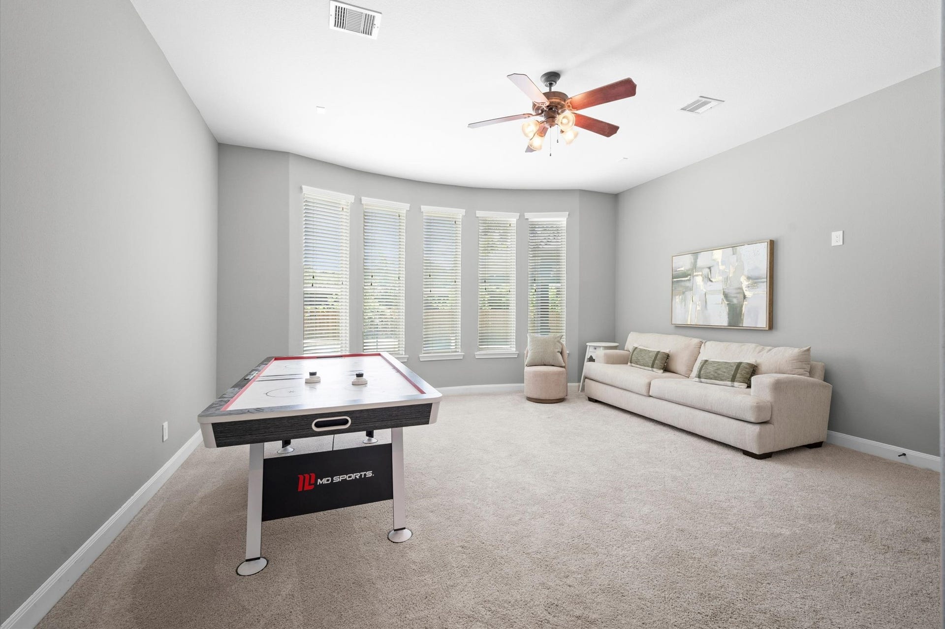24611 Waterstone Estates Circle S, Tomball, TX 77375 A large flex space serves as a game room or a secondary living space. It is attached to a media room.