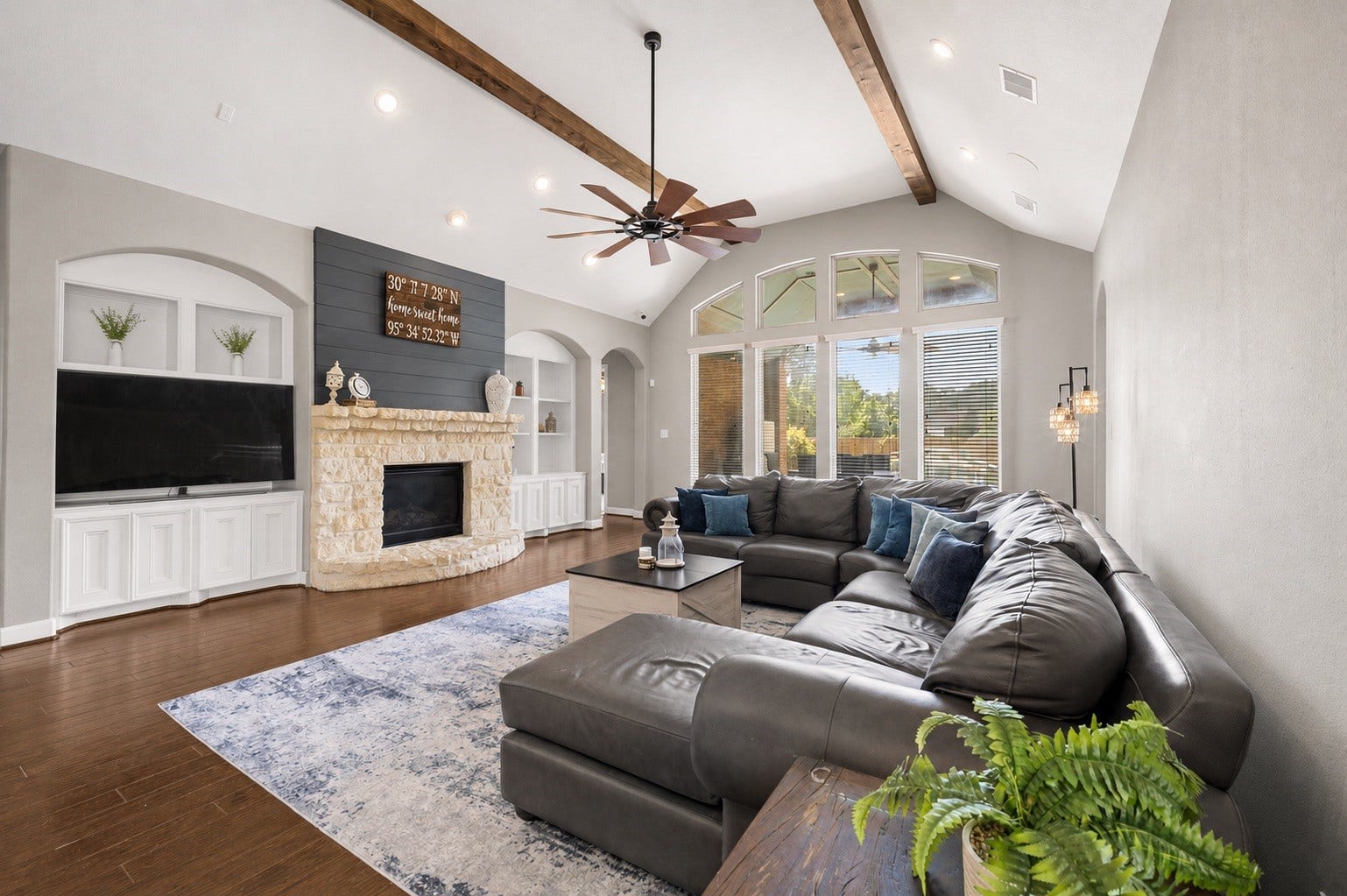 24611 Waterstone Estates Circle S, Tomball, TX 77375 Step into this inviting living room that rests under a vaulted ceiling. Enjoy the backyard view by day or cozy up to the gas fireplace on a cool evening.