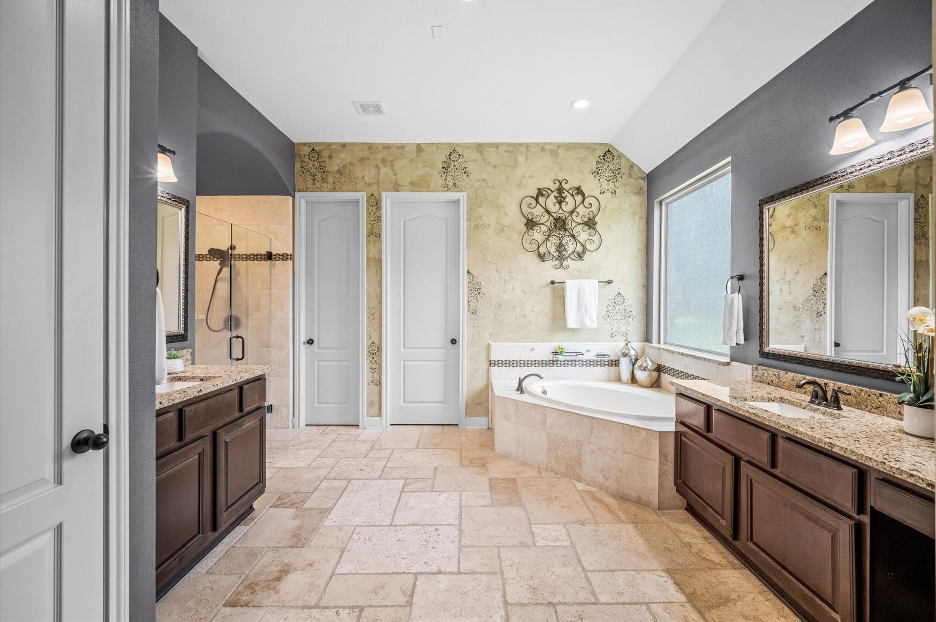 24611 Waterstone Estates Circle S, Tomball, TX 77375 A second vanity rests across from the first, near the relaxing soaking tub.