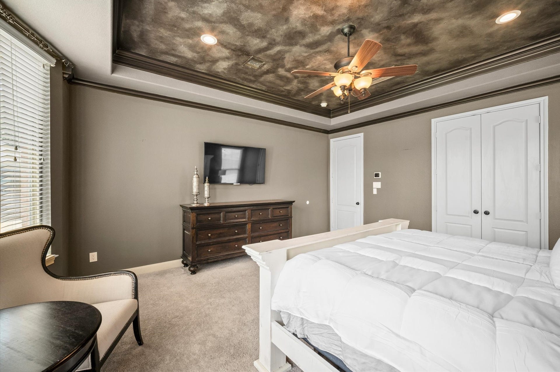24611 Waterstone Estates Circle S, Tomball, TX 77375 The elegant painted ceiling is a showstopper in this incredible primary retreat! The dark trim offers the perfect accent.