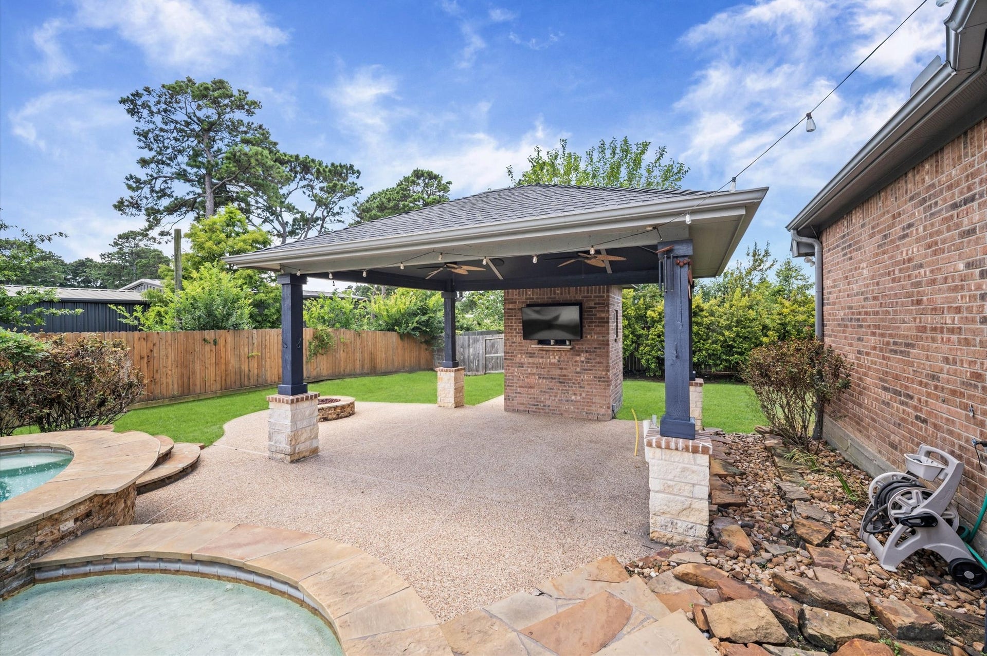 24611 Waterstone Estates Circle S, Tomball, TX 77375 The gazebo is a great place for a collection of lounge chairs or even a future bar. Notice the firepit located on the side.