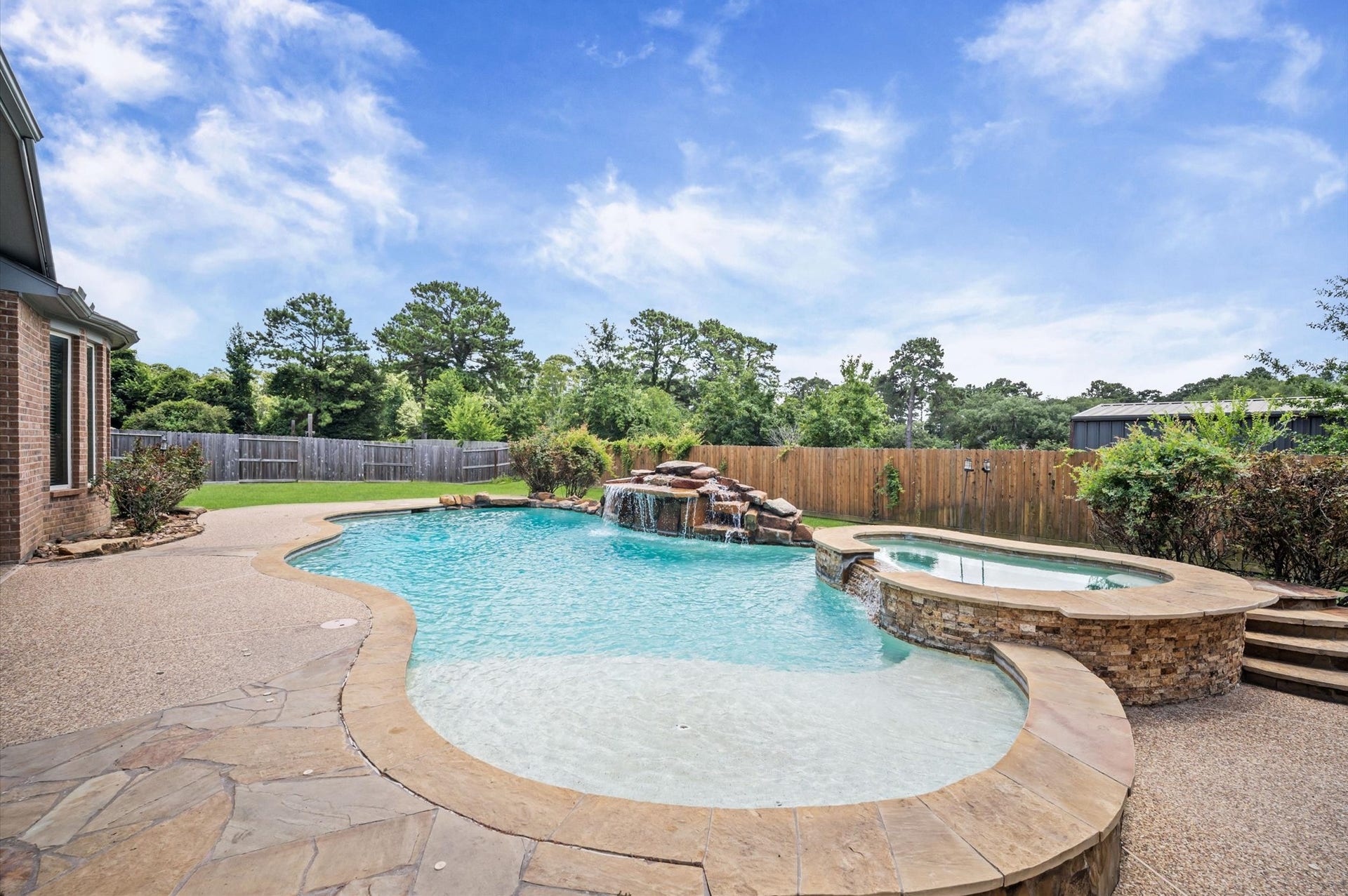 24611 Waterstone Estates Circle S, Tomball, TX 77375 Imagine a relaxing day outdoors. Step in the pool and relax on the tanning shelf to enjoy some sun while keeping cool in the pool!