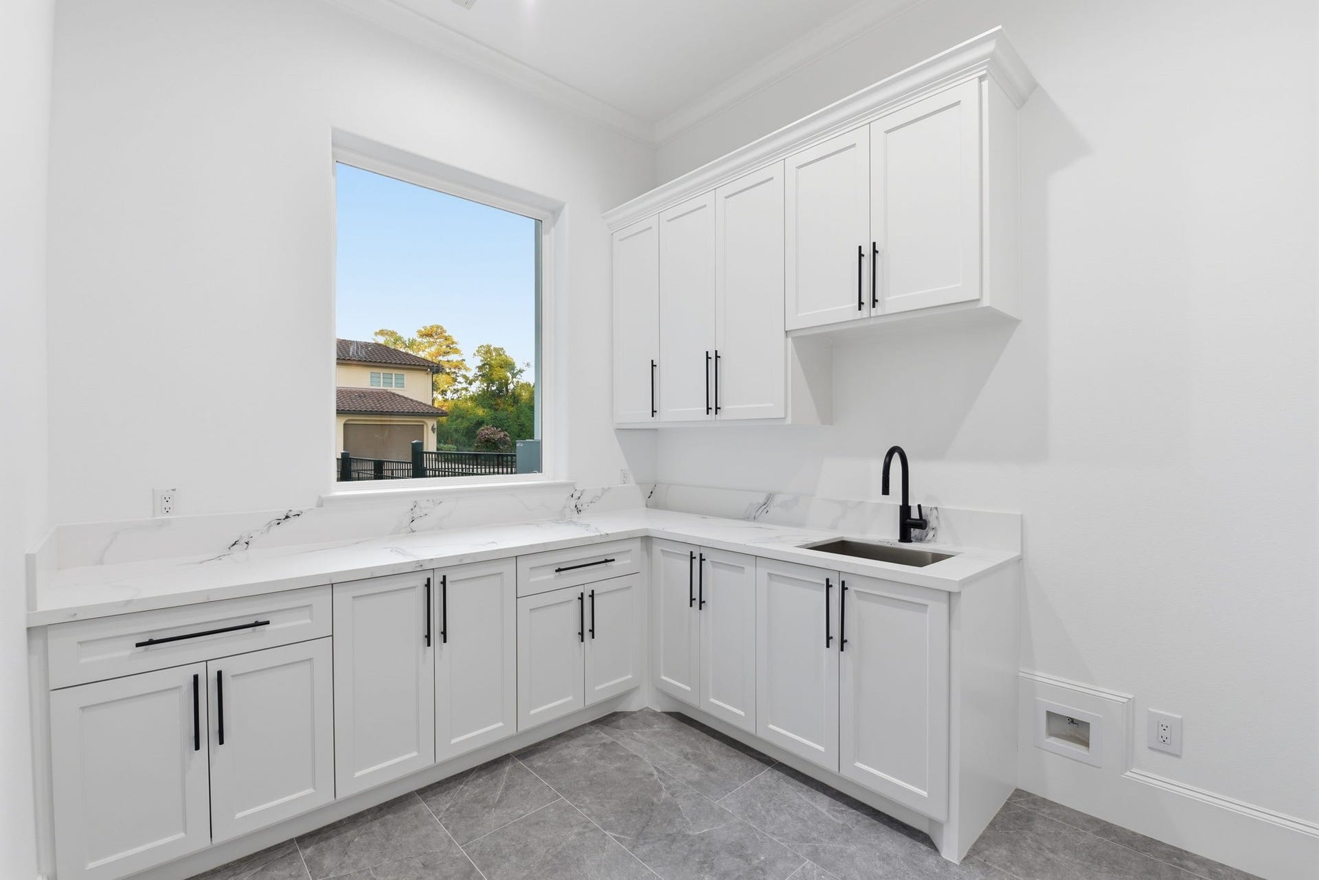 6112 Cypresswood Drive, Spring, TX 77379 Utility Room with room for extra refrigerator
