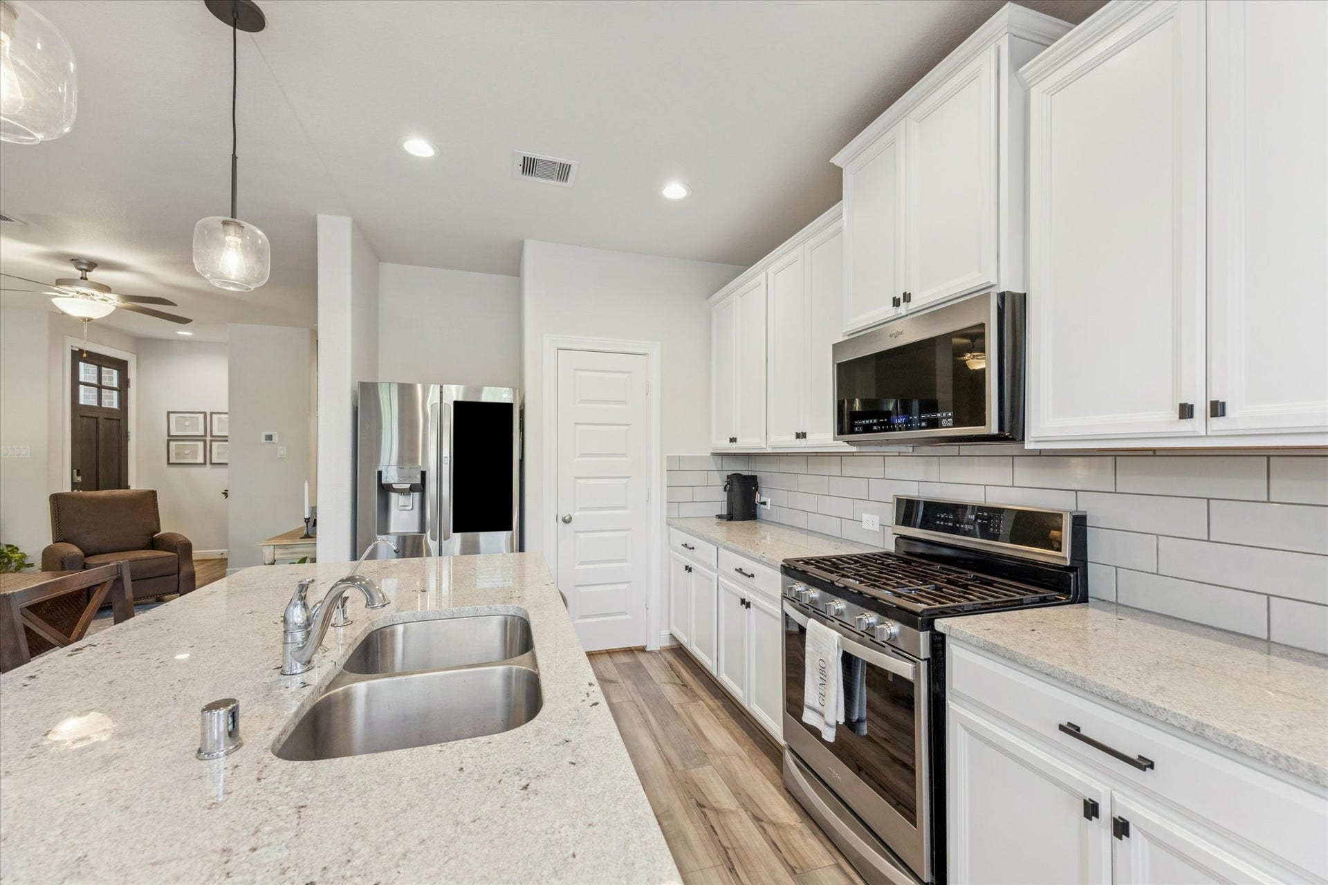 Modern design meets everyday functionality in this bright kitchen