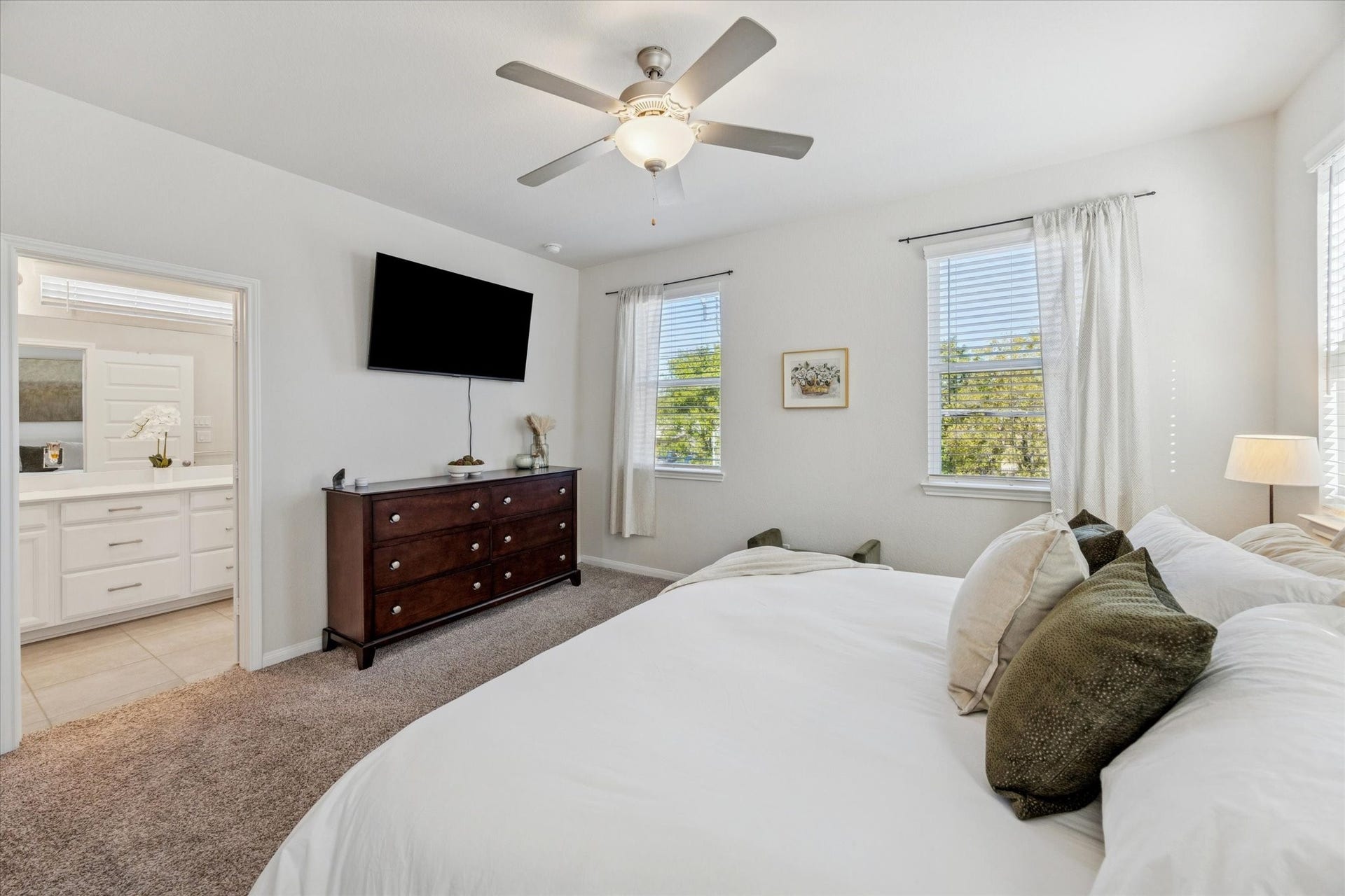A serene primary suite designed for rest and relaxation.