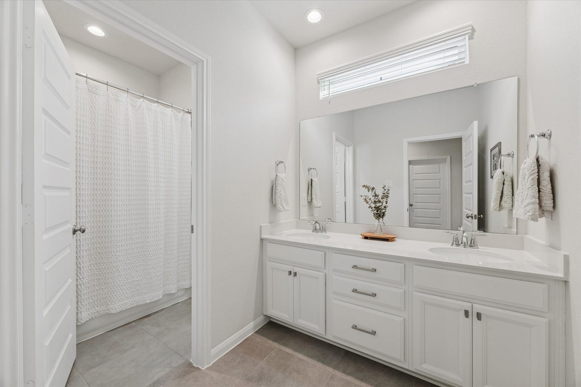 Dual vanities and a spacious layout make mornings easy.