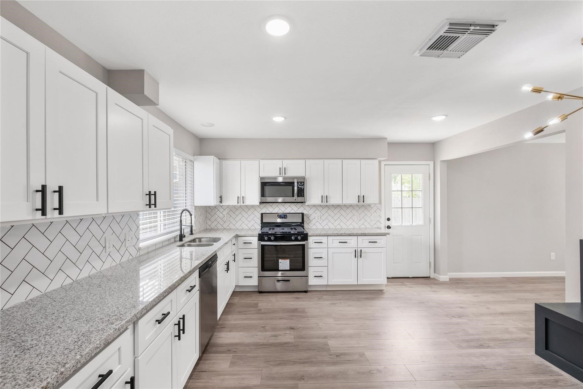4523 Waterfall Way, Sugar Land, TX 77479 Completely renovated, the kitchen features updated cabinetry, modern finishes, and plenty of counter space.