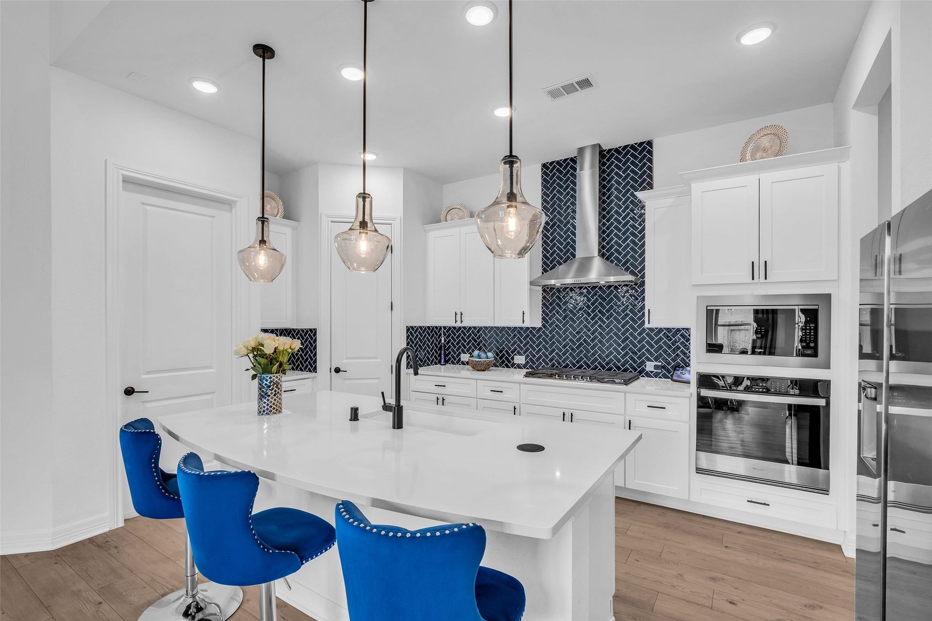 13520 Leeward Edge Drive, Texas City, TX 77568 A closer view of the kitchen island highlights the stylish pendant lights hanging above.
