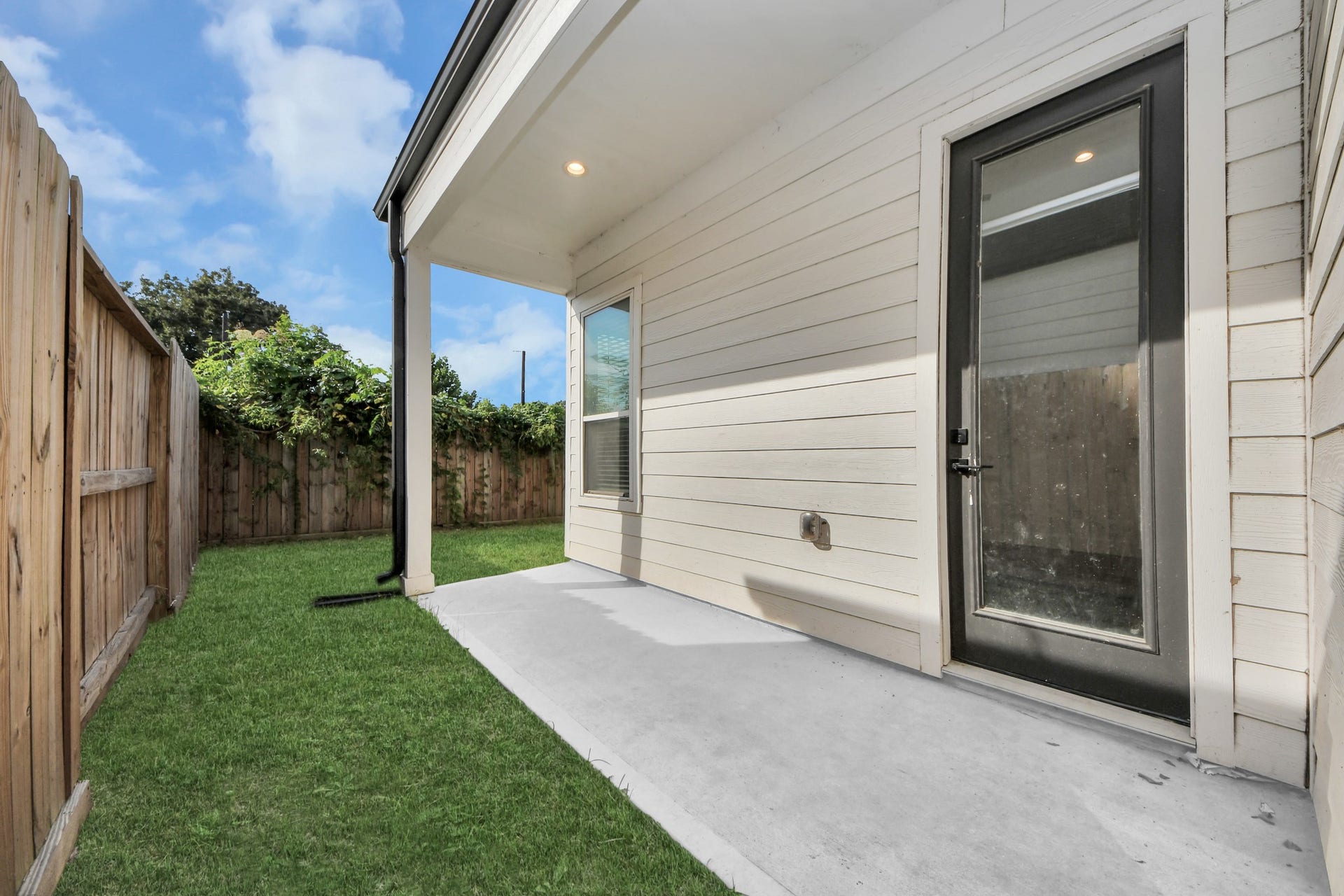 Patio area with enough space for outdoor furniture for lounging.