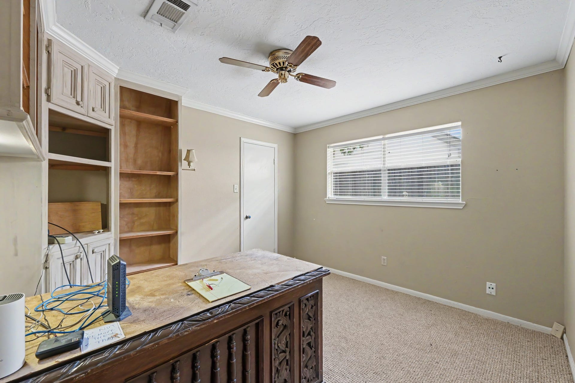 2710 N Logrun Circle, The Woodlands, TX 77380 All the rooms are nice sized with closets. This bedroom is set up as an office. The large desk is available for purchase.