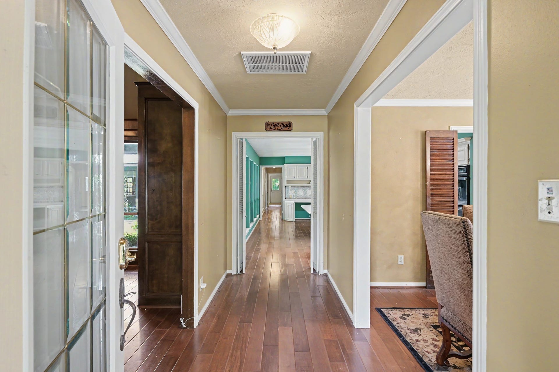 2710 N Logrun Circle, The Woodlands, TX 77380 There is a long hallway as you enter the house.
