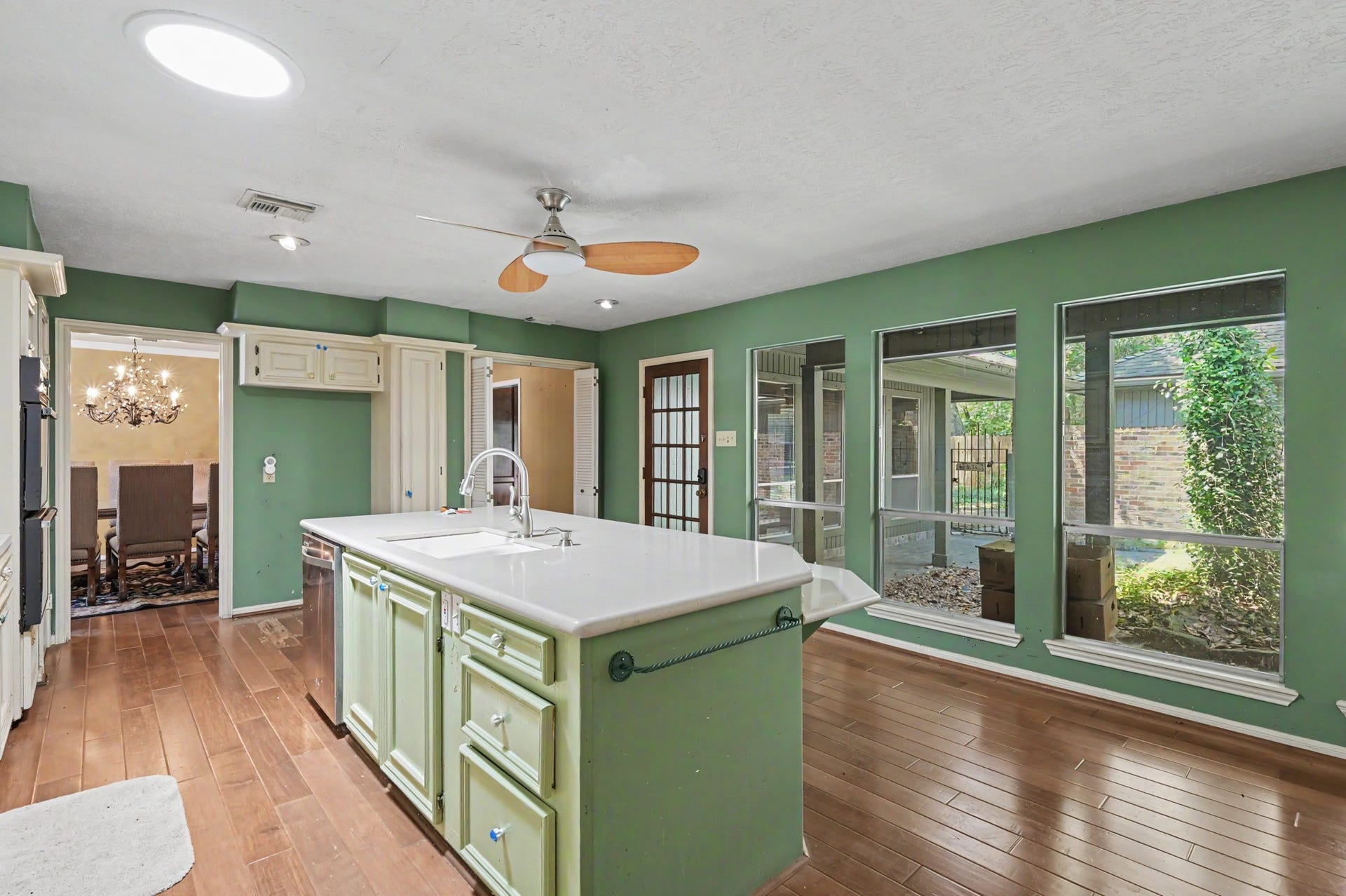 2710 N Logrun Circle, The Woodlands, TX 77380 The kitchen overlooks the courtyard. The Island has a lot of Storage.