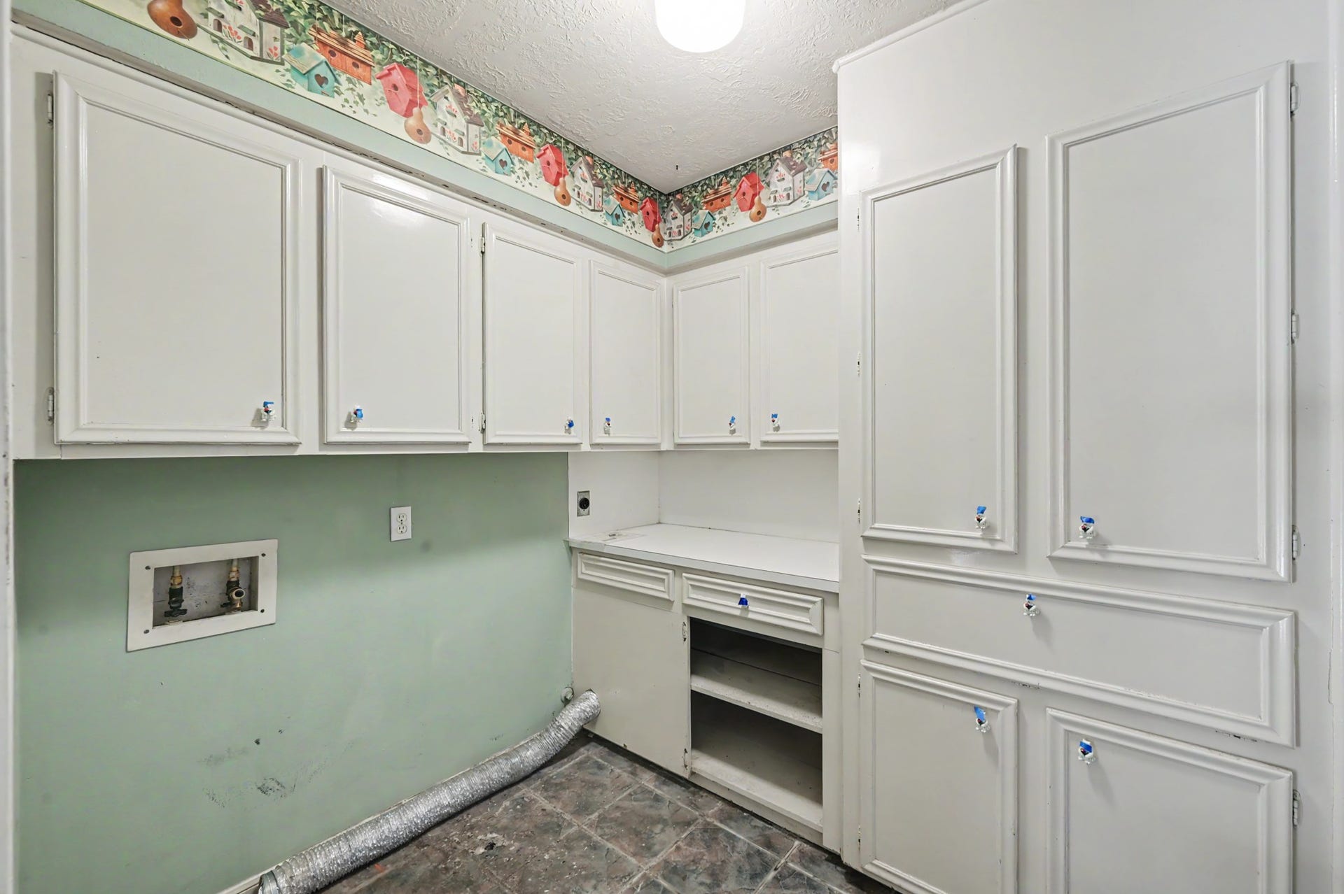 2710 N Logrun Circle, The Woodlands, TX 77380 As you wrap around the house, you pass by the Utility Room which offers added storage.