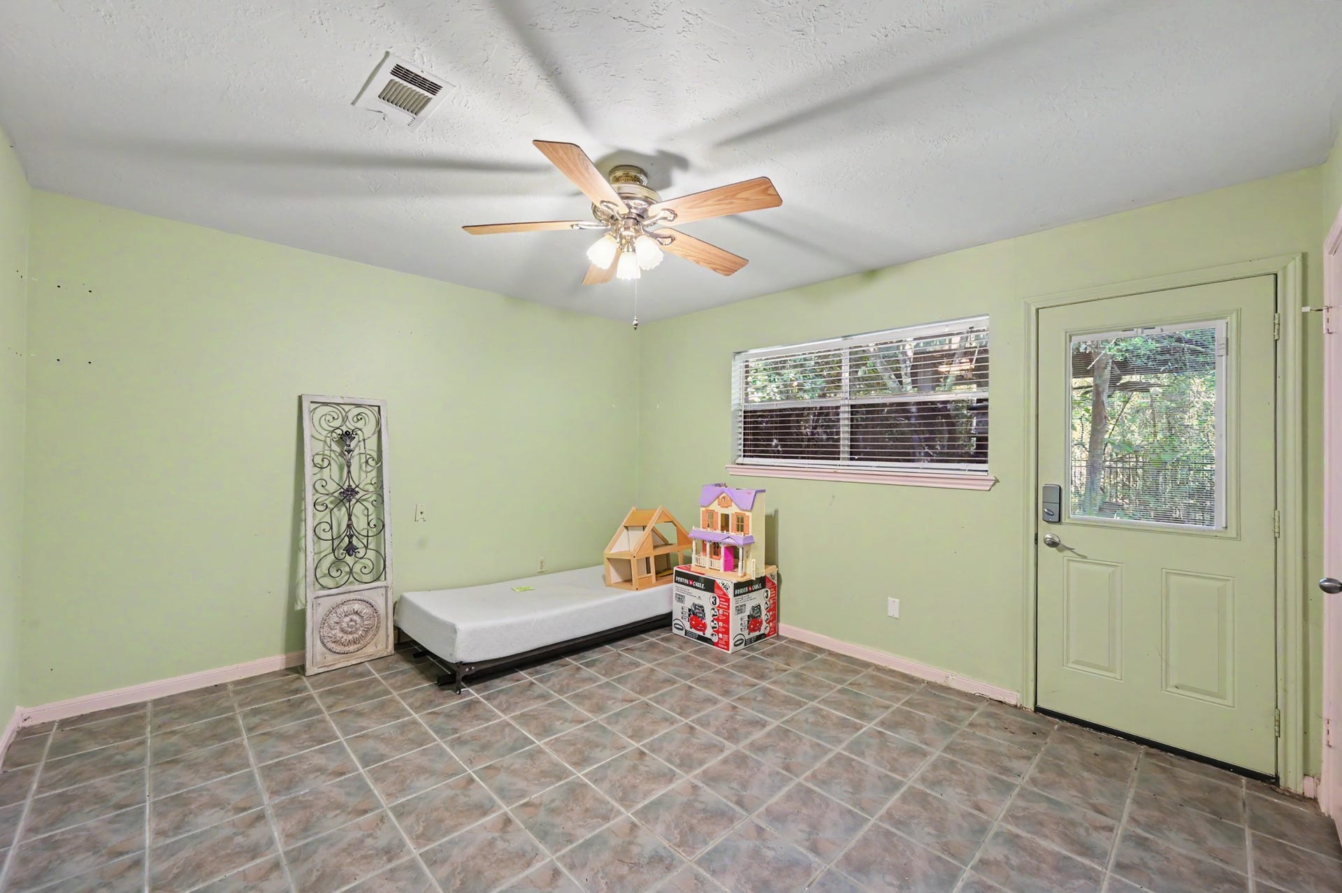 2710 N Logrun Circle, The Woodlands, TX 77380 This third Secondary bedroom has a door which leads out to the backyard.
