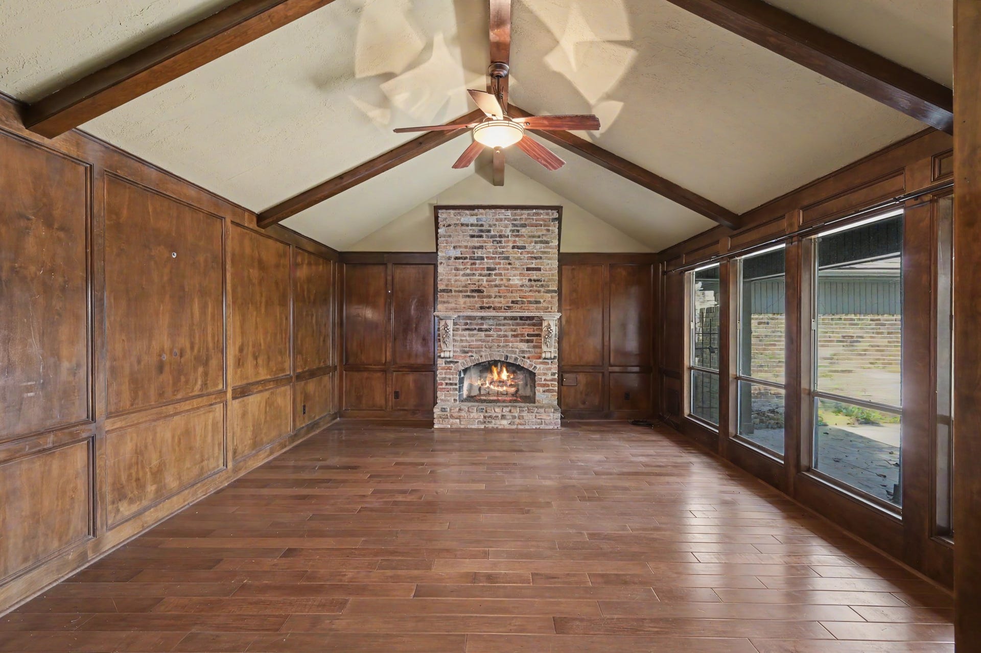 2710 N Logrun Circle, The Woodlands, TX 77380 There is a gas log fireplace and great windows looking onto the courtyard.