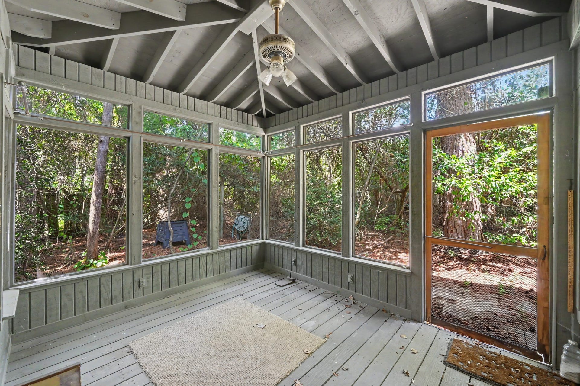 2710 N Logrun Circle, The Woodlands, TX 77380 Attached to the Sunroom is a screened in porch overlooking the natural landscape of the backyard.