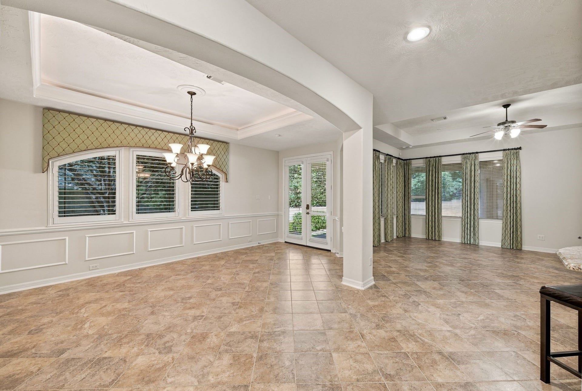 Dining Room with Living Room directly ahead and Kitchen to the right
