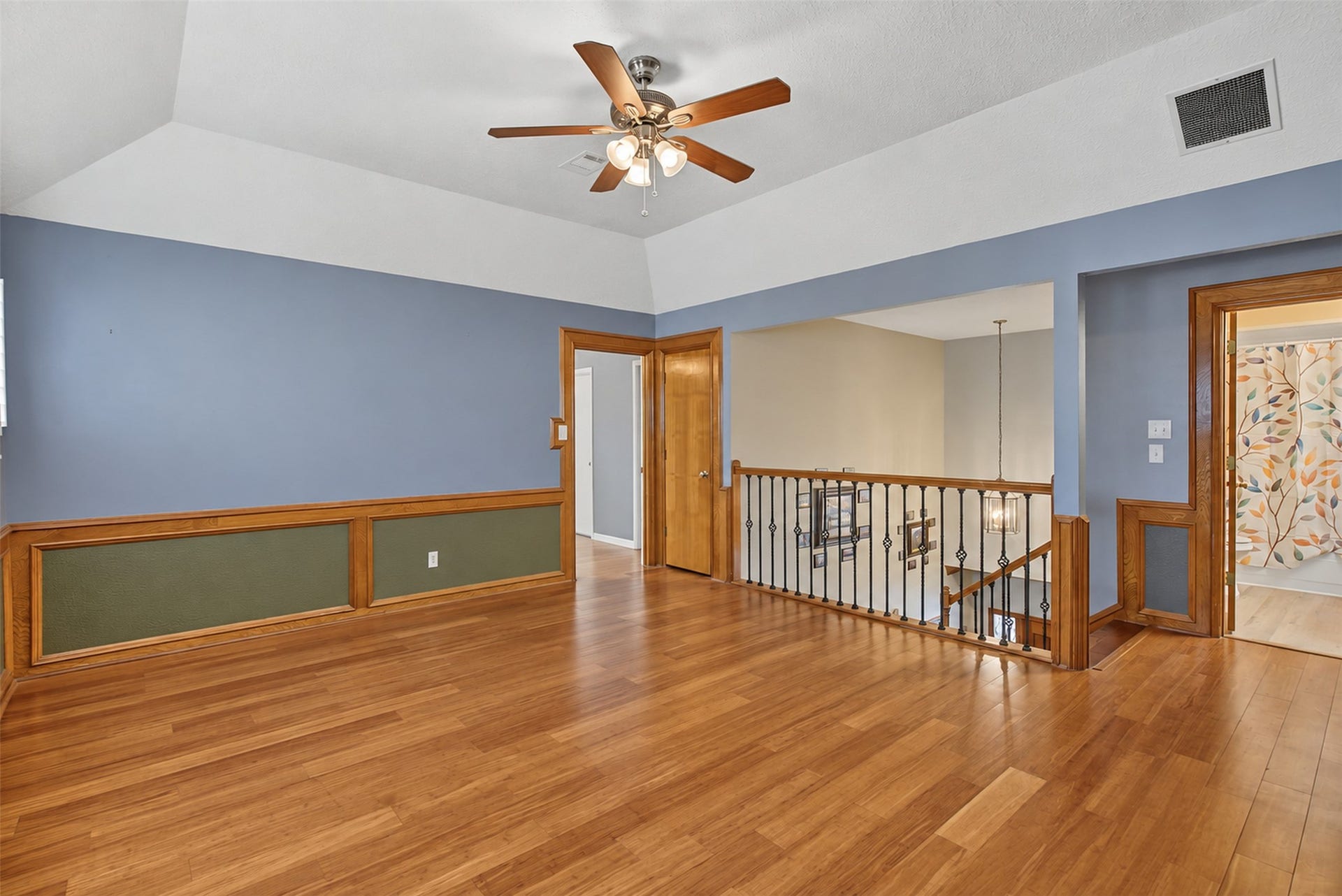 Gameroom with Glimps of Full Bath Upstairs