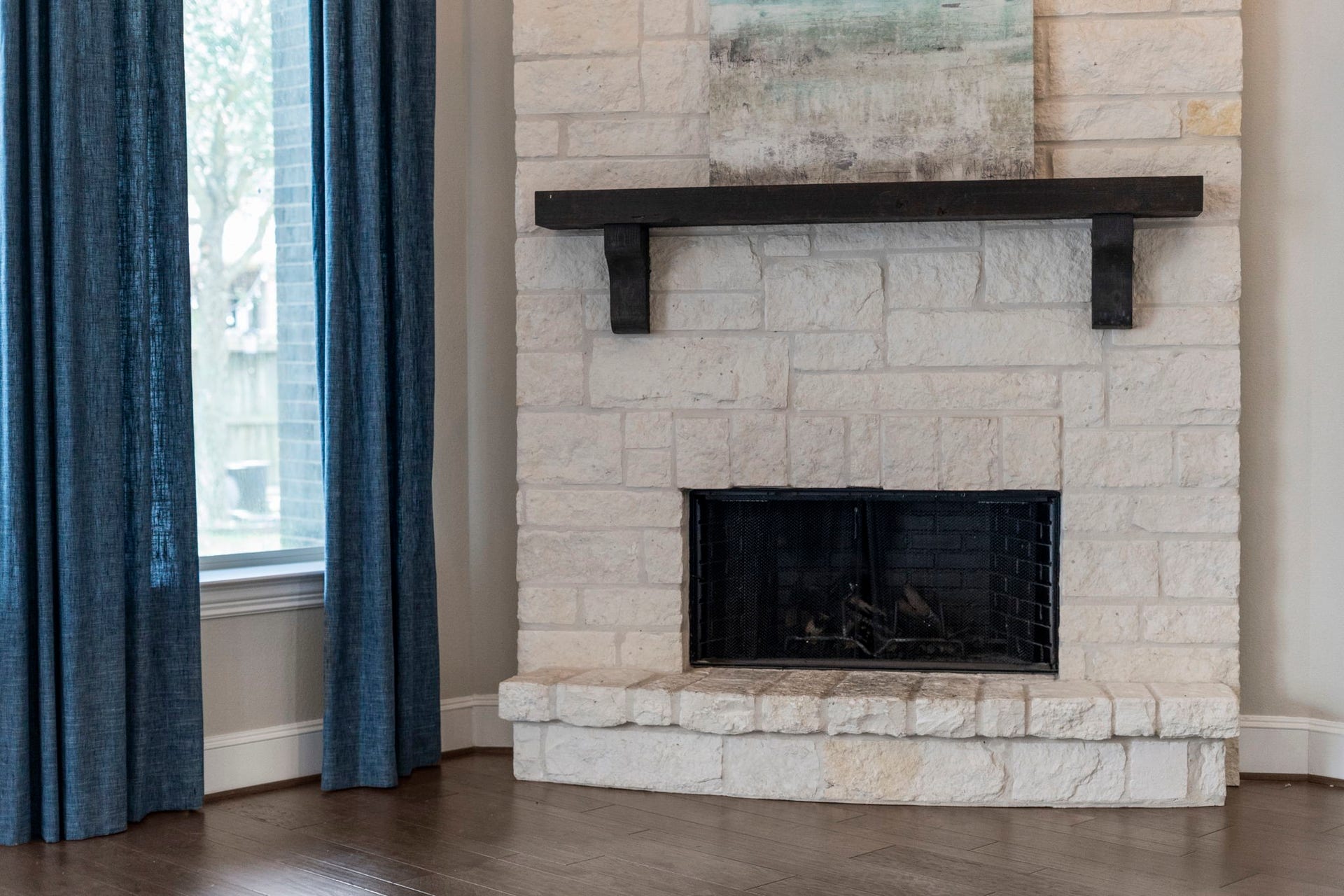 9410 Mount Logan, Missouri City, TX 77459 A stone fireplace with beam accents