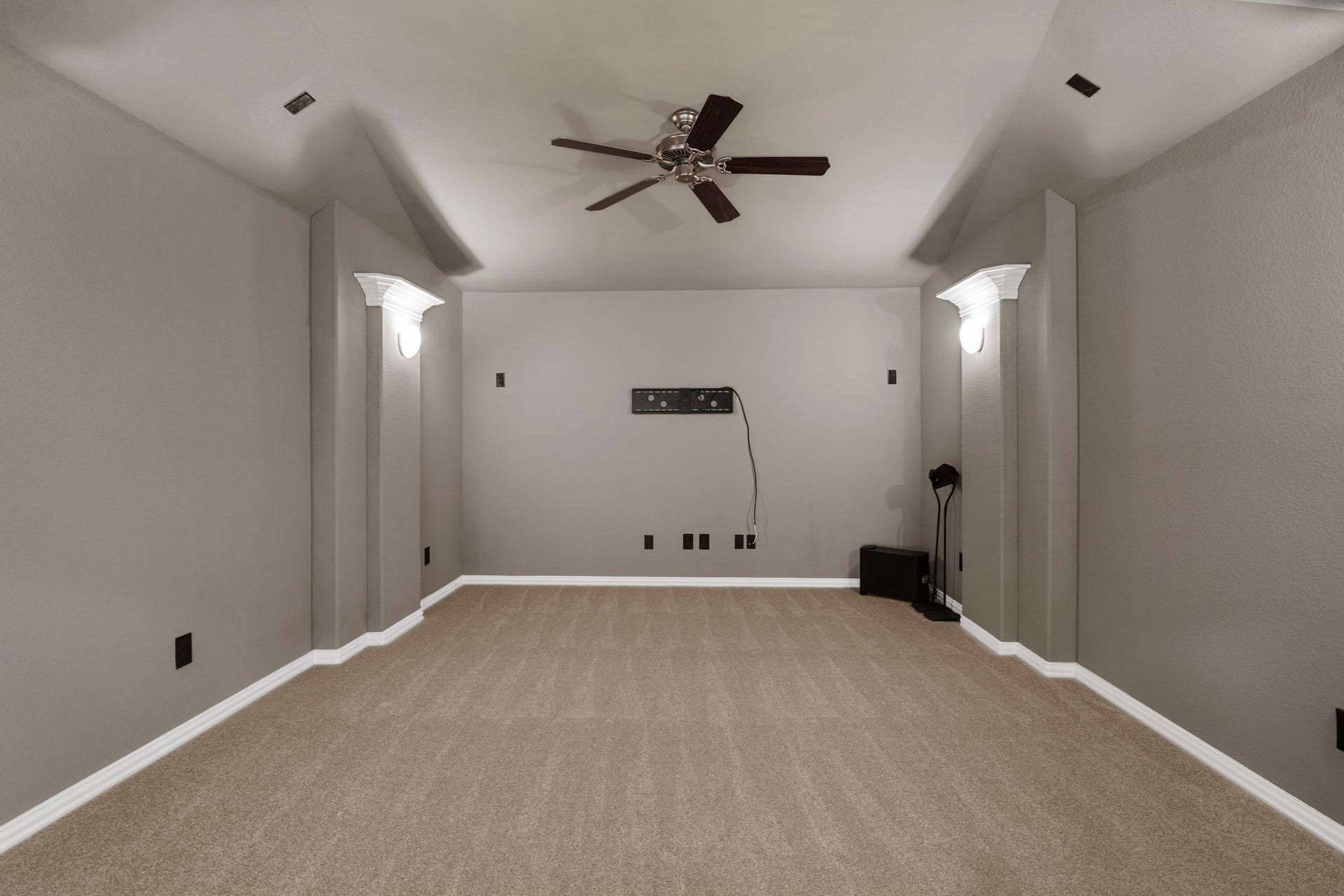 9410 Mount Logan, Missouri City, TX 77459 A dedicated media room is designed for the ultimate entertainment experience, featuring theater-style architectural details and recessed lighting. Whether hosting game days, streaming your favorite series, or enjoying a cinematic experience at home, this versatile space is ready to impress.