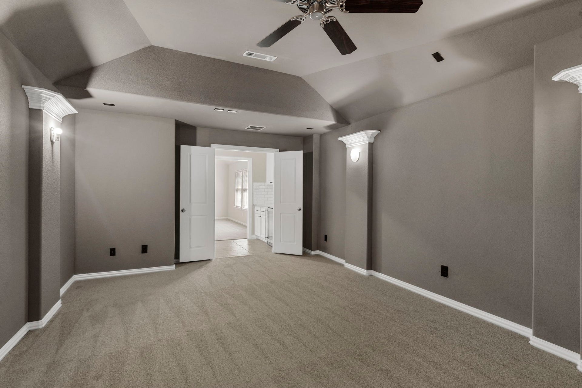 9410 Mount Logan, Missouri City, TX 77459 The media room features cinematic lighting.