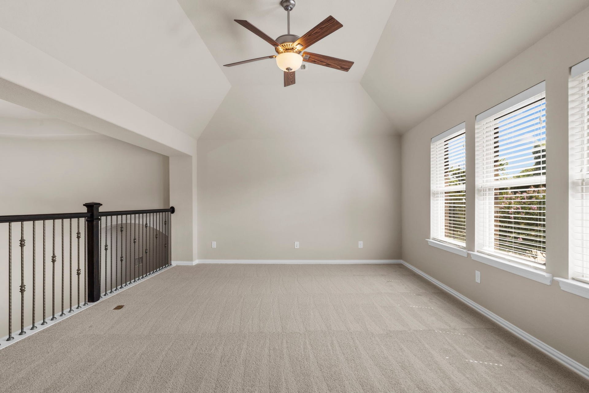 9410 Mount Logan, Missouri City, TX 77459 A massive game room with soaring vaulted ceilings offers endless flexibility for a pool table, a secondary living space, or a dedicated recreation area.