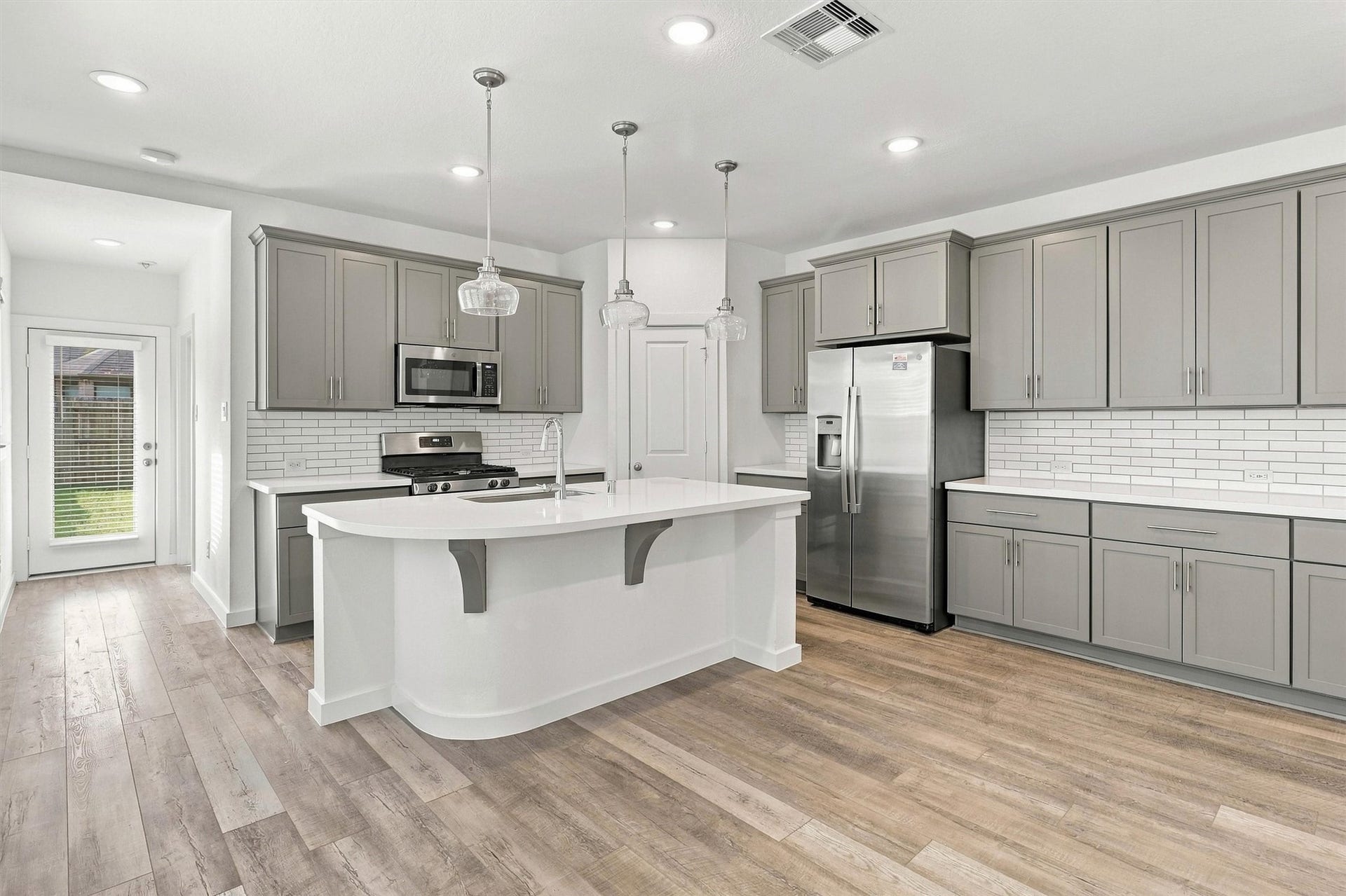 13109 Blue Flora Drive, Texas City, TX 77568 This kitchen has ample cabinetry and storage space, and enough countertop space for all of your kitchen prep needs.