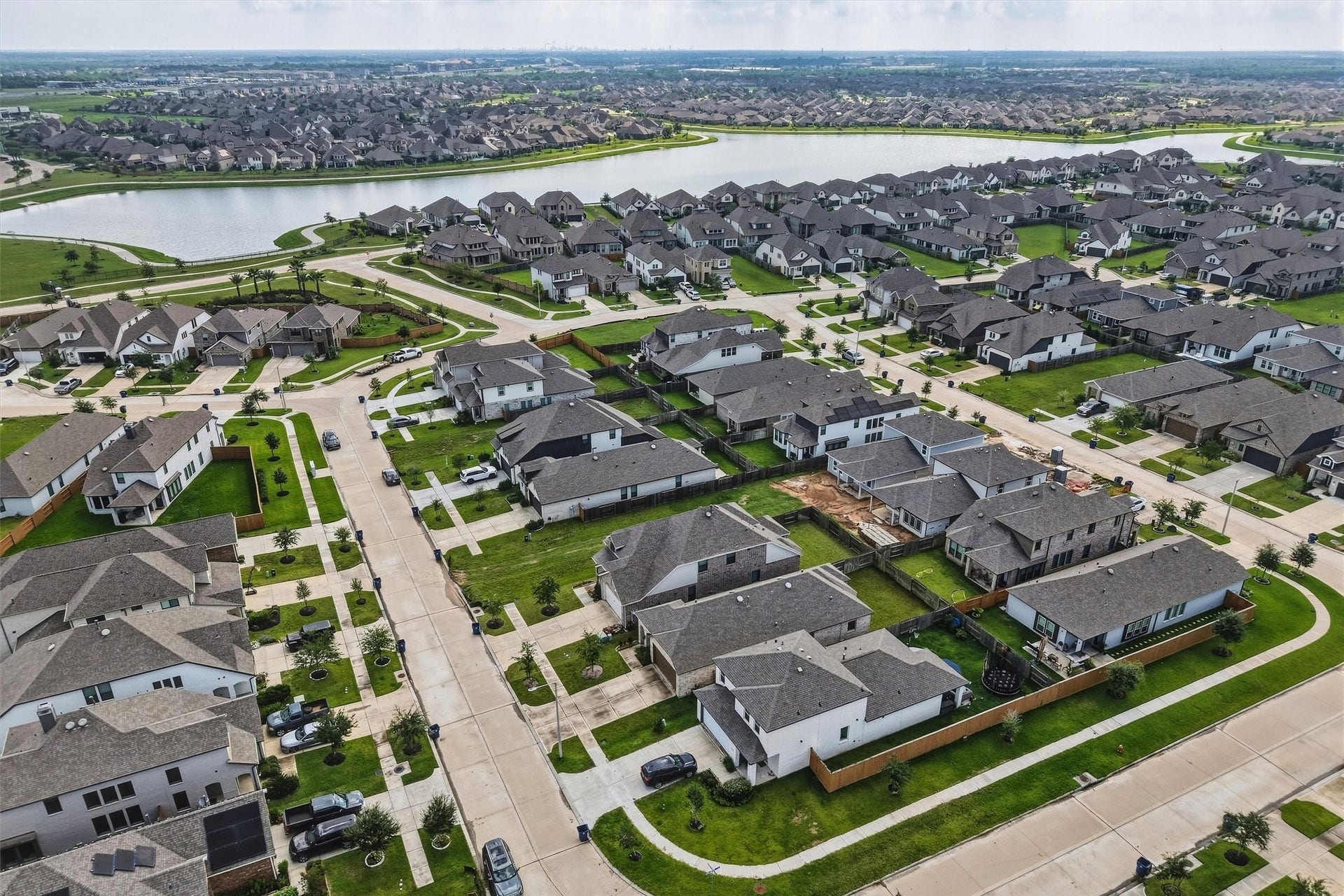 13109 Blue Flora Drive, Texas City, TX 77568 Home is located walking distance to the neighborhood ponds, where you can have a quiet day of fishing.