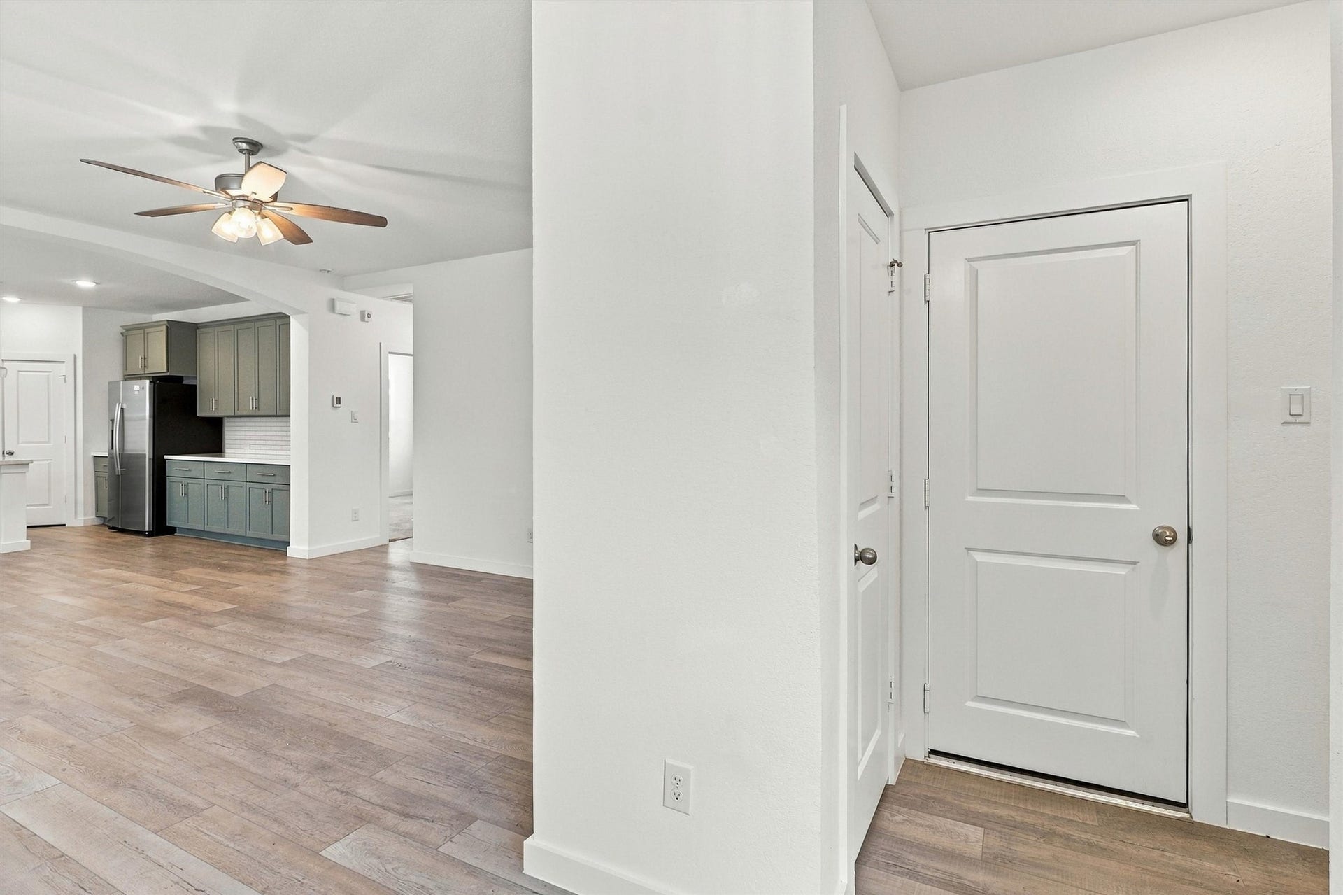 13109 Blue Flora Drive, Texas City, TX 77568 Entry way features storage closet (door to the Left), garage entry, and laundry room (directly to the Right).
