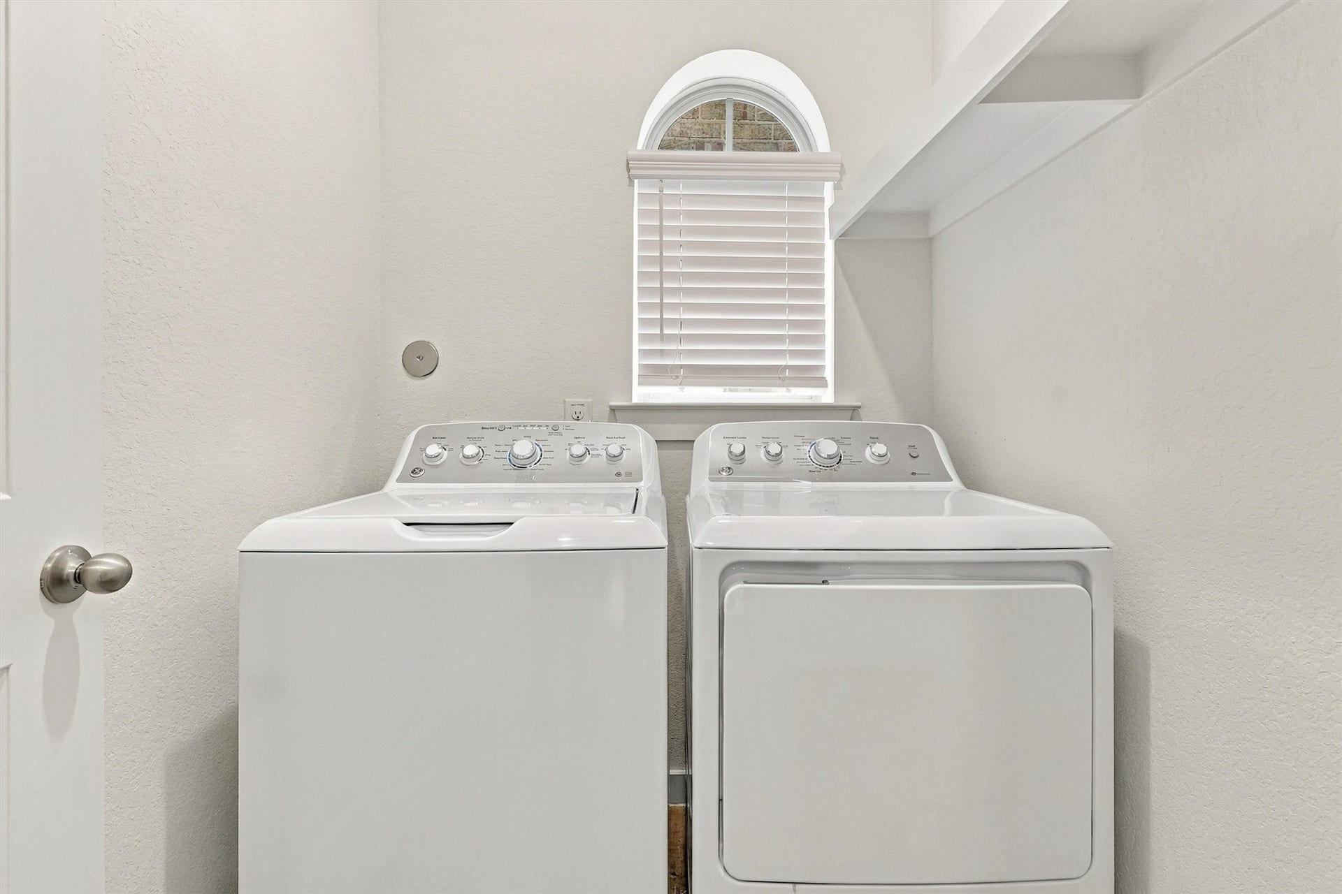 13109 Blue Flora Drive, Texas City, TX 77568 Laundry room with window and built-in shelf!