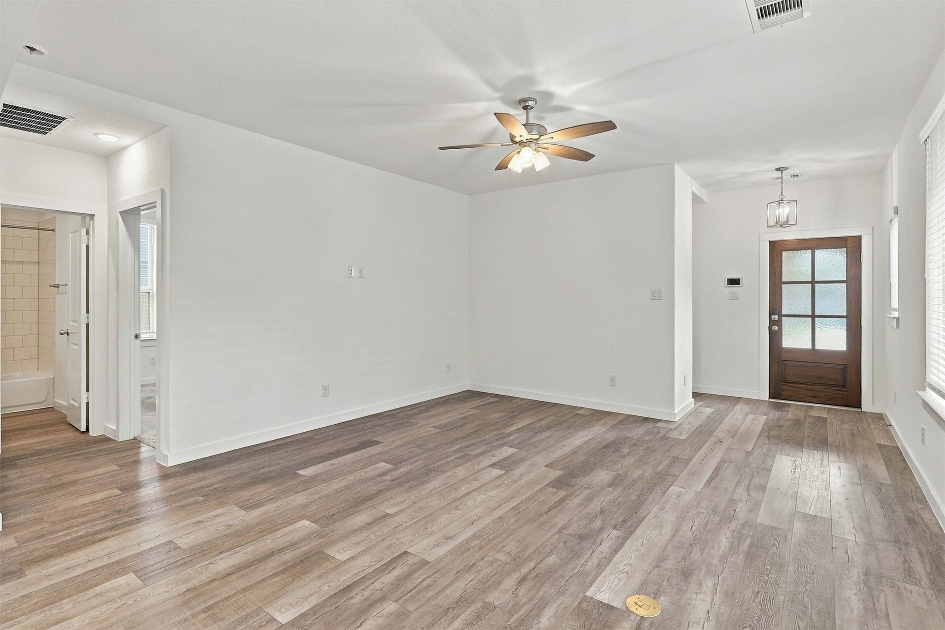 13109 Blue Flora Drive, Texas City, TX 77568 To the left of the living room, find two secondary bedrooms and a full bath!