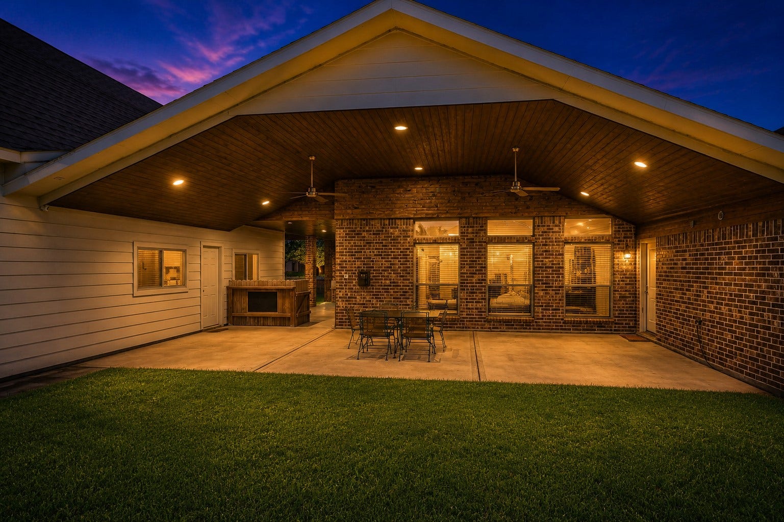 2109 Verde Valley Drive, League City, TX 77573 Beautiful back porch that extends from breezeway with wood ceilings, modern recessed dimmable lighting for the perfect evening ambiance with ceiling fans to keep it breezy during the warm Texas summers.