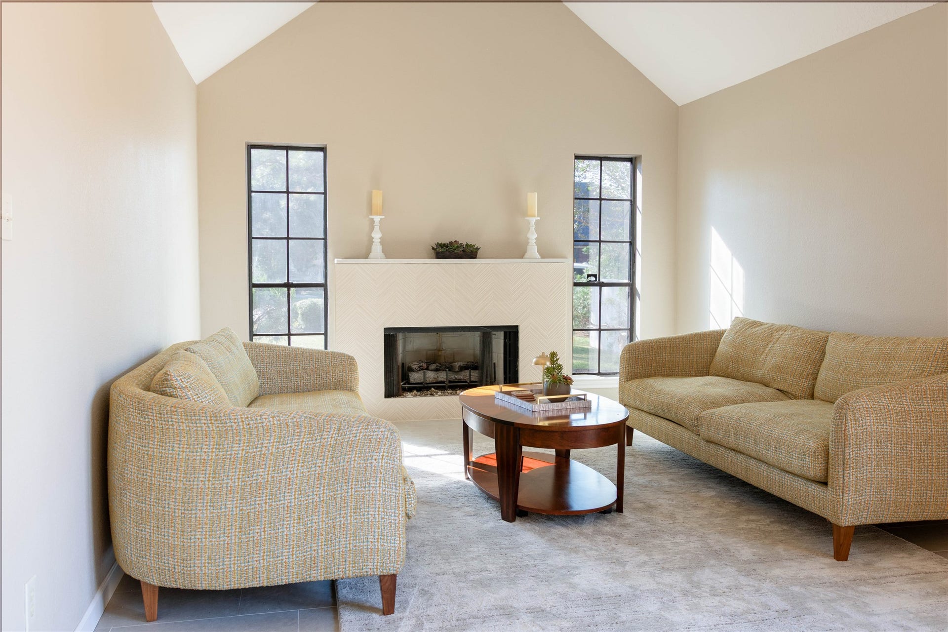 Living area with vaulted ceiling and gas log fireplace.