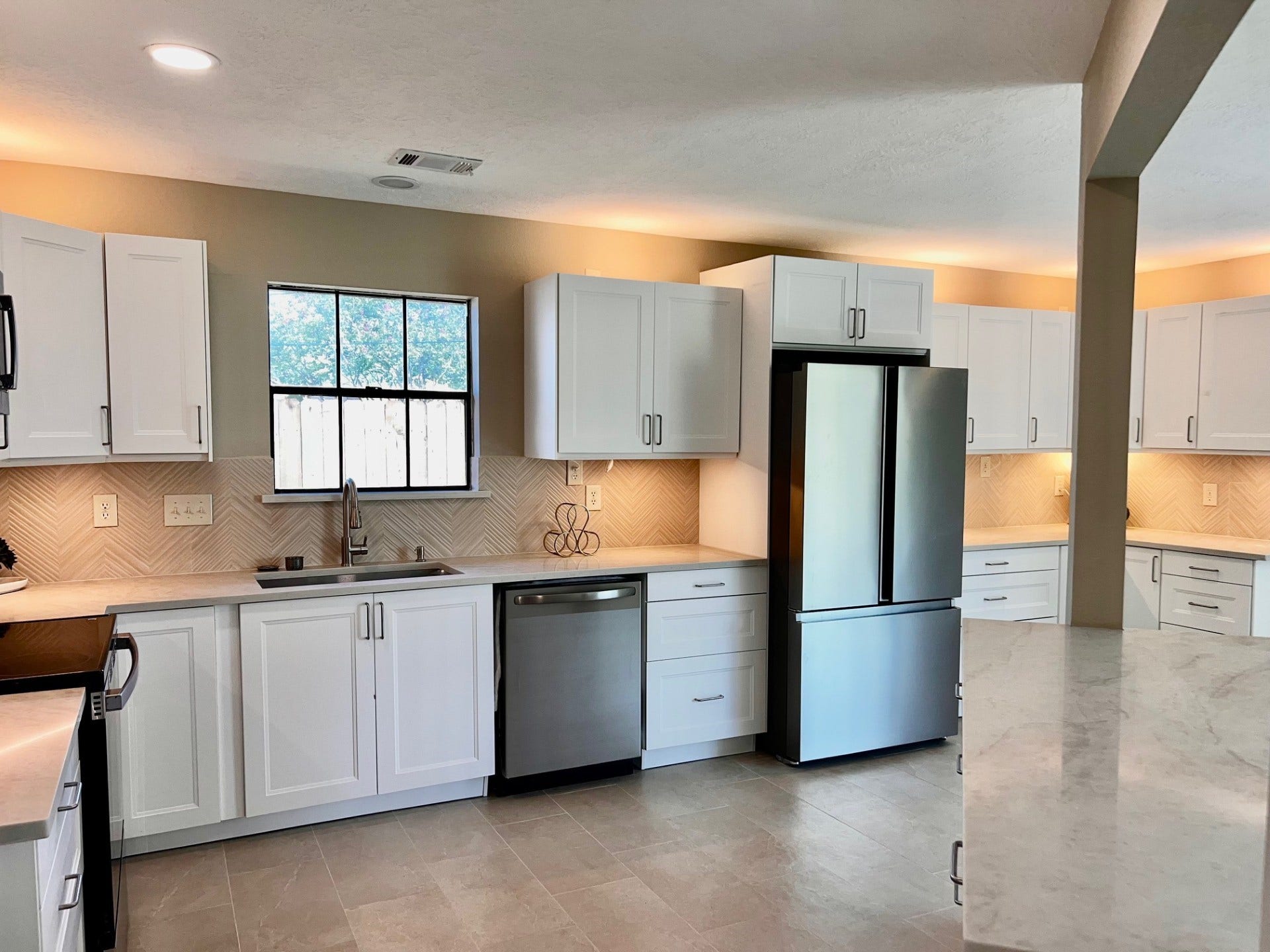 Beautiful quartz countertops found in this dreamy kitchen.