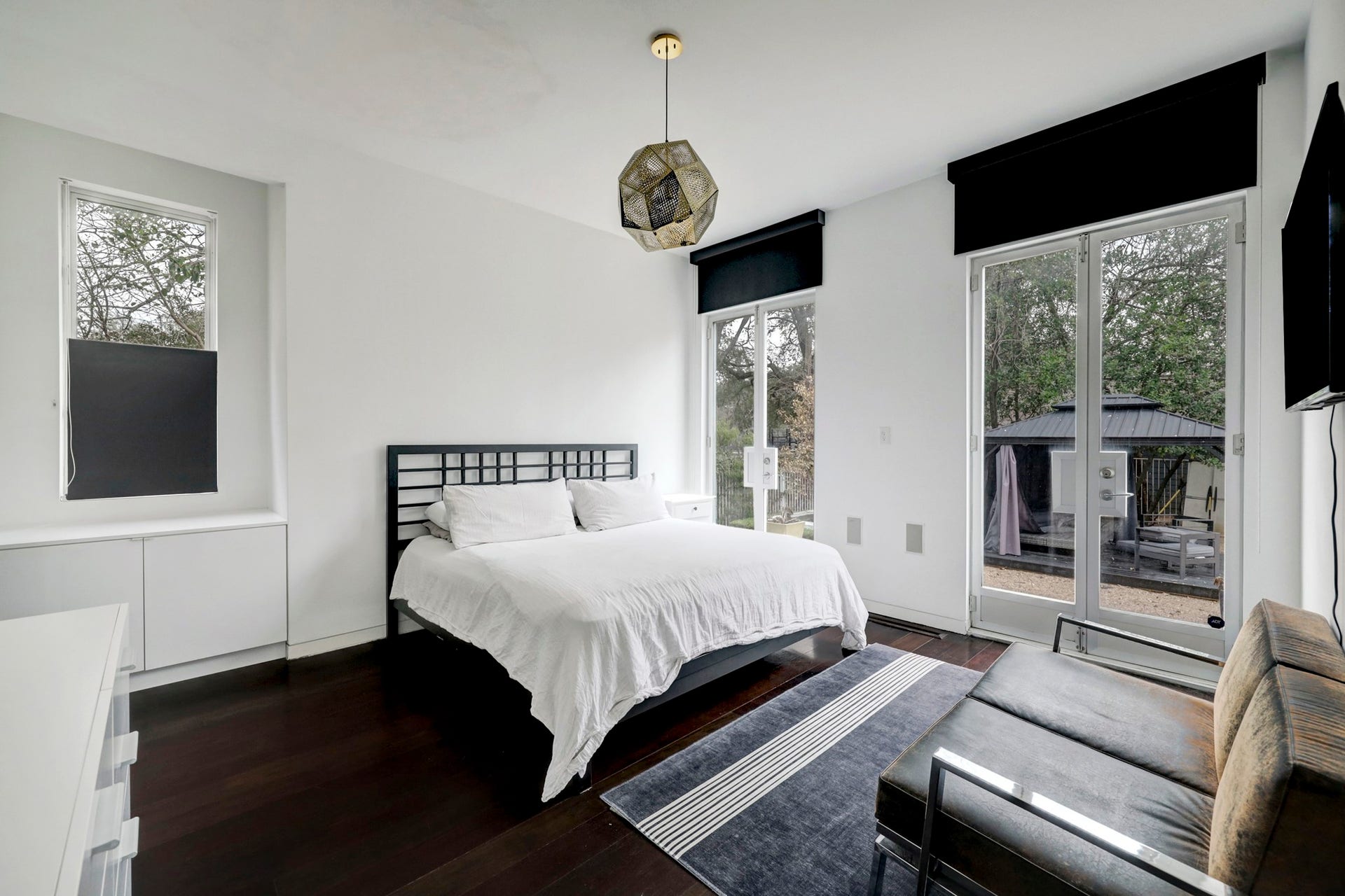 2200 Harvard Street, Houston, TX 77008 The downstairs bedroom 2 offers built-in storage, a profusion of natural light when you want it, and blackout shades when you don't.