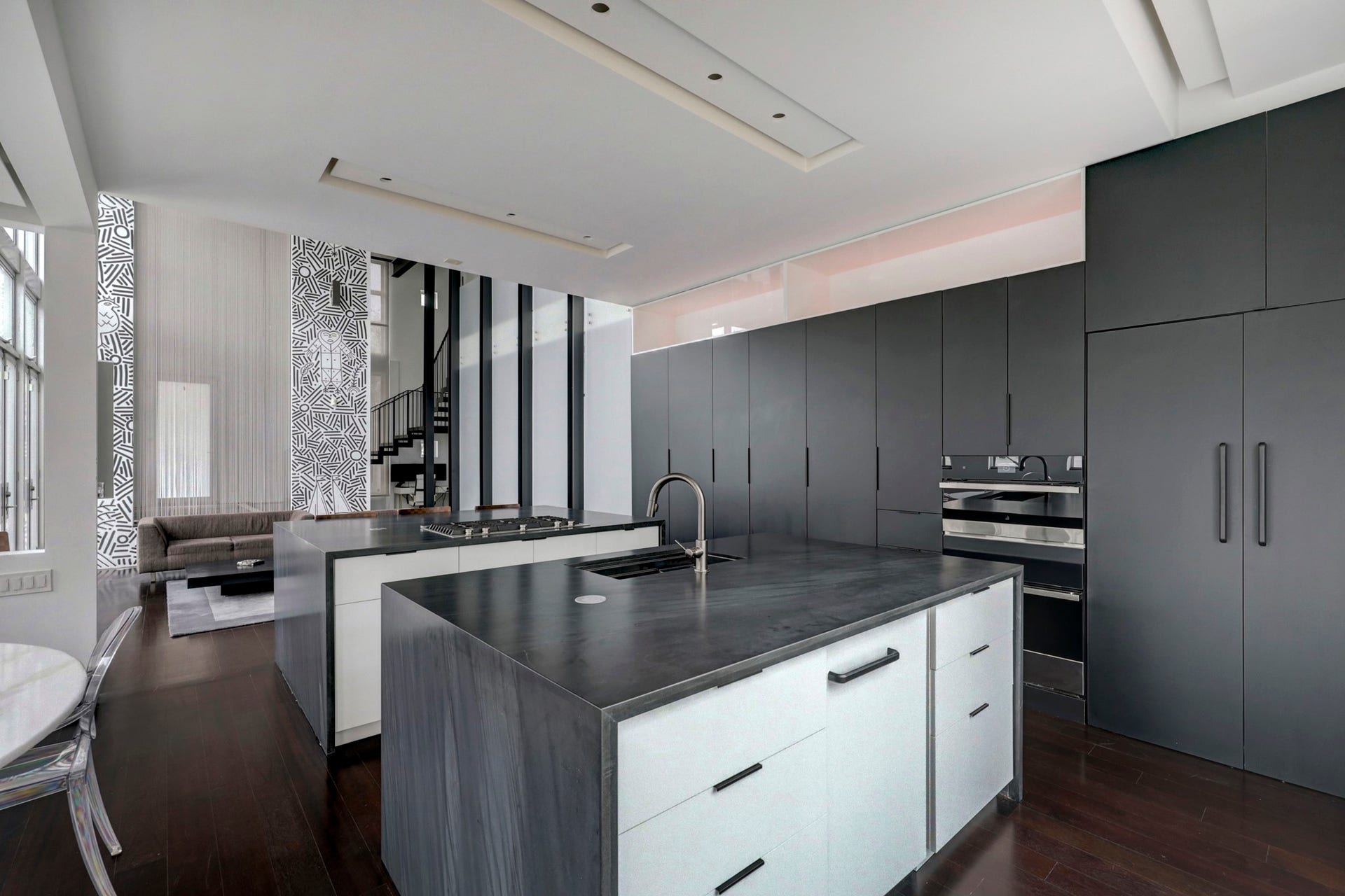 2200 Harvard Street, Houston, TX 77008 Providing an abundance of space to prepare meals and entertain, this gourmet kitchen is a chefs dream. The spacious area features waterfall quartzite counters, updated appliance set, a subzero fridge, a wine fridge, and breakfast bar seating.