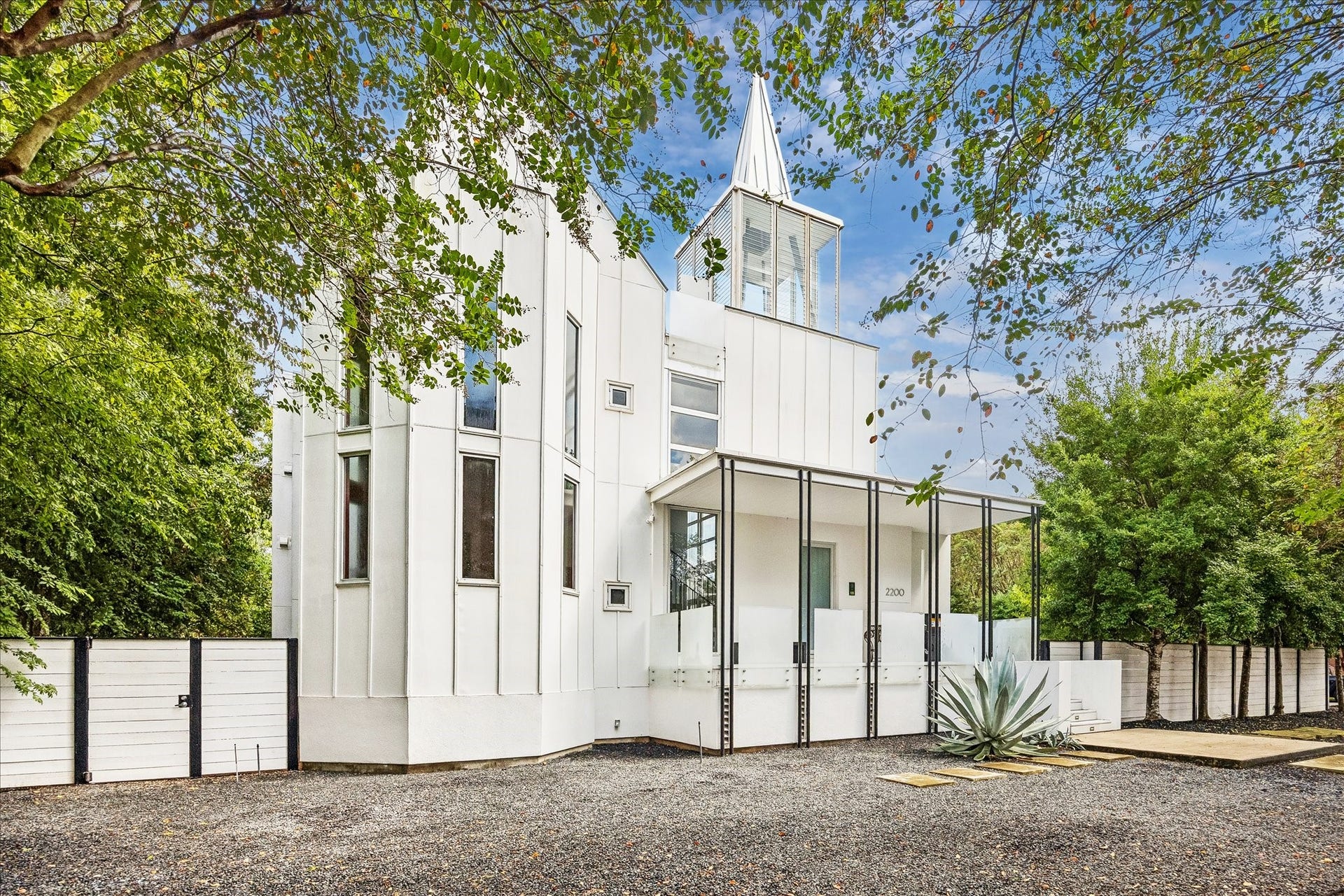 2200 Harvard Street, Houston, TX 77008 The white exterior, paired with a stately steeple, creates a beautiful and inviting facade.