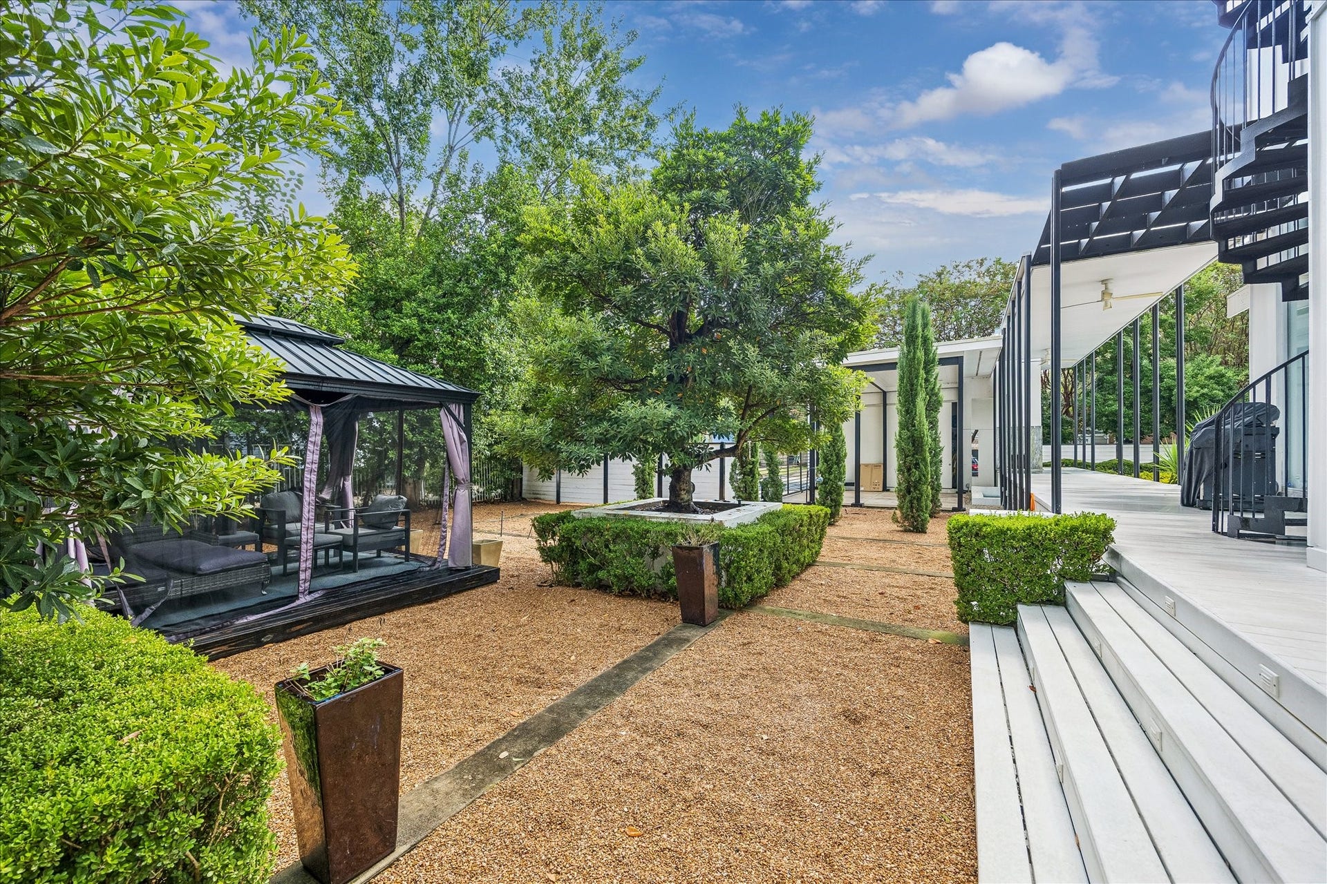 2200 Harvard Street, Houston, TX 77008 Beyond the pool, an additional outdoor living area offers abundant space for lounging, dining, and gathering, creating yet another inviting setting for everyday enjoyment and entertaining.