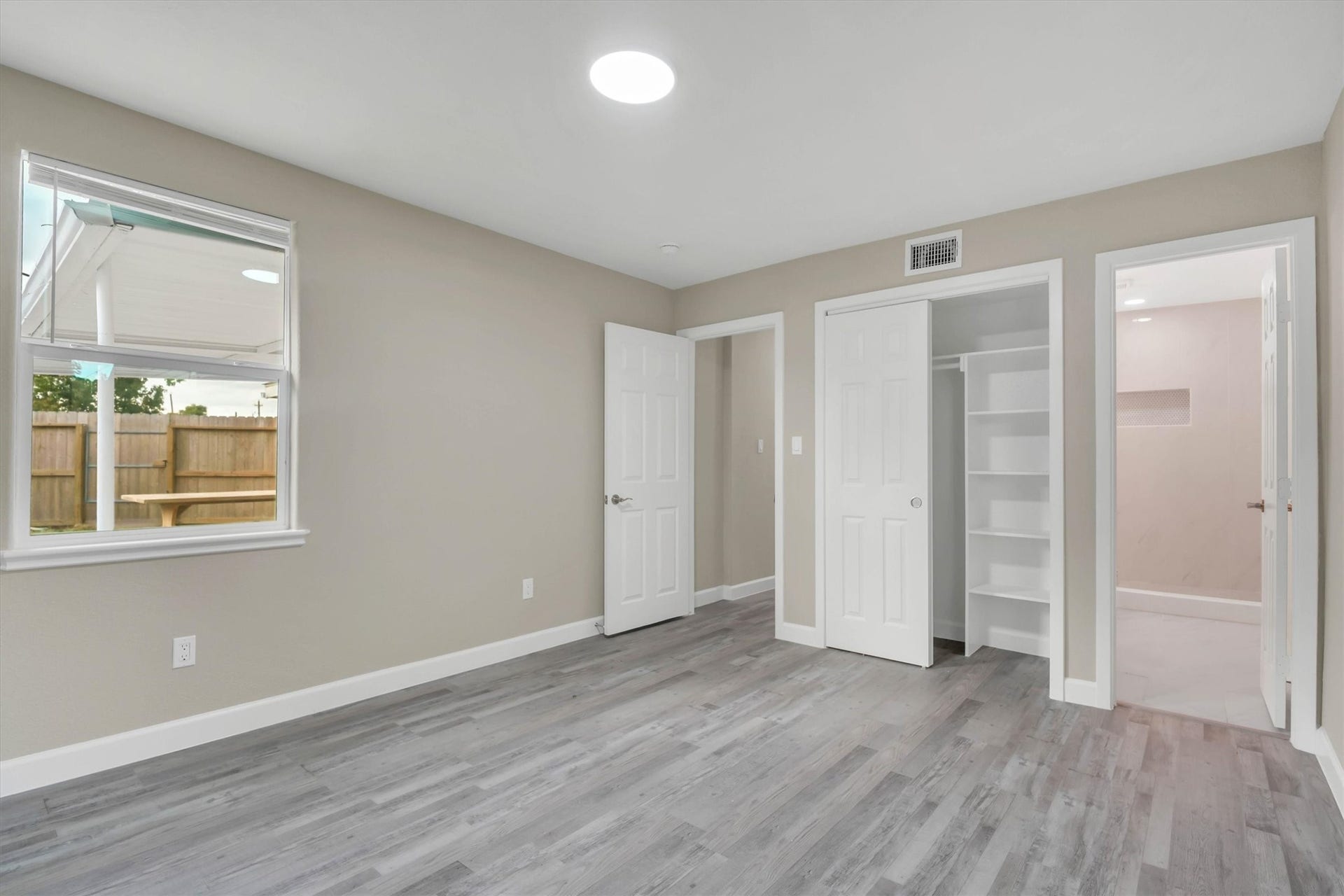 Spacious bedroom with ample closet space, and a private en-suite bathroom.