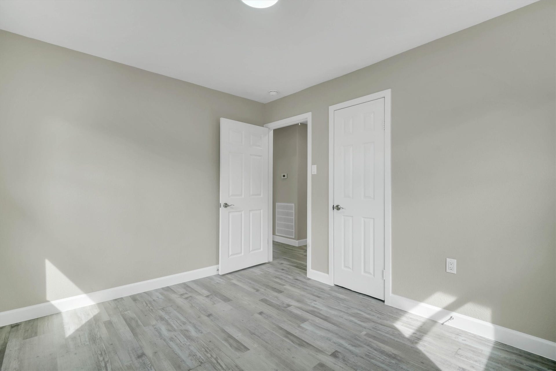 Another view of the bedroom towards the hallway.