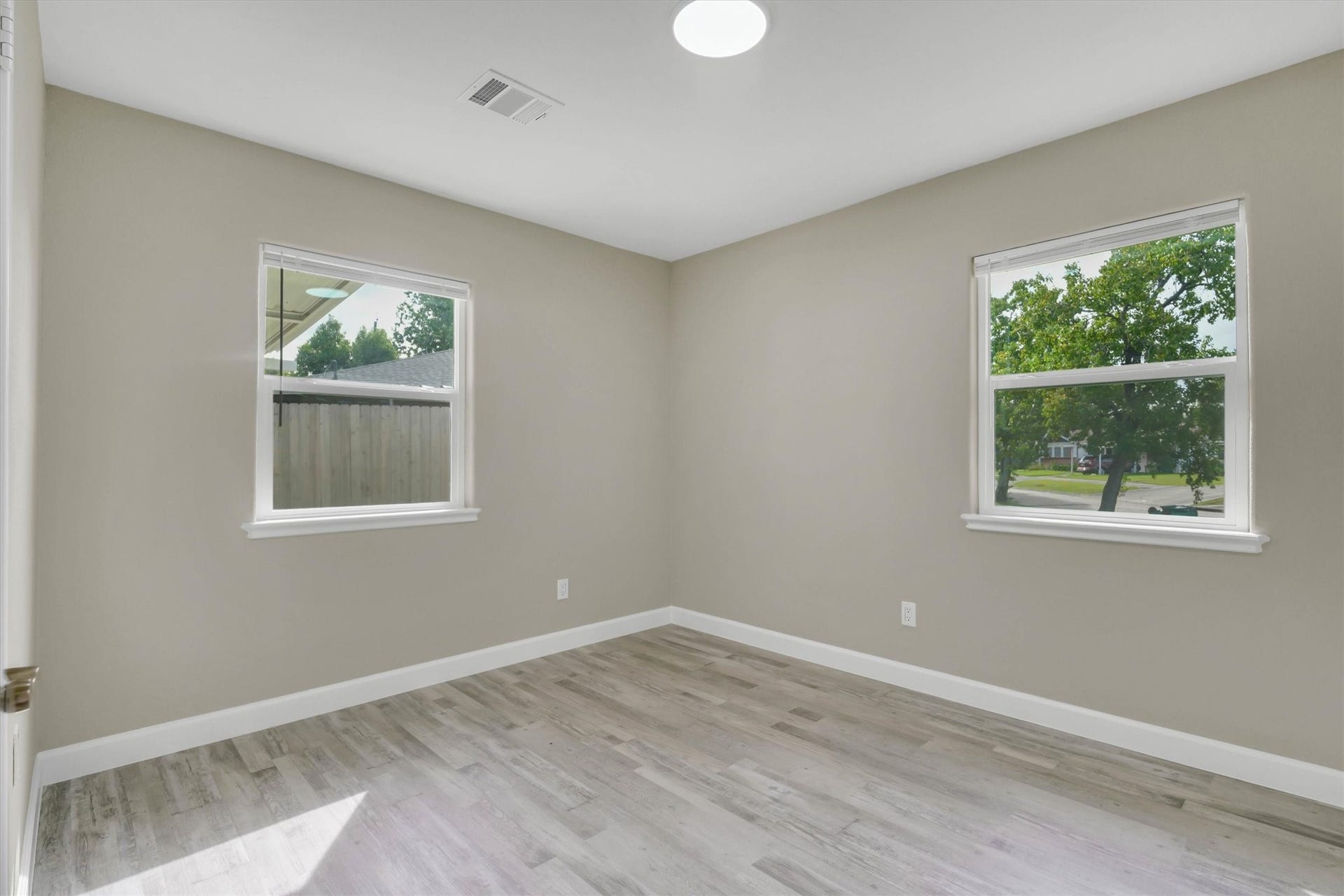 Two large windows, perfect for a cozy bedroom or office space.