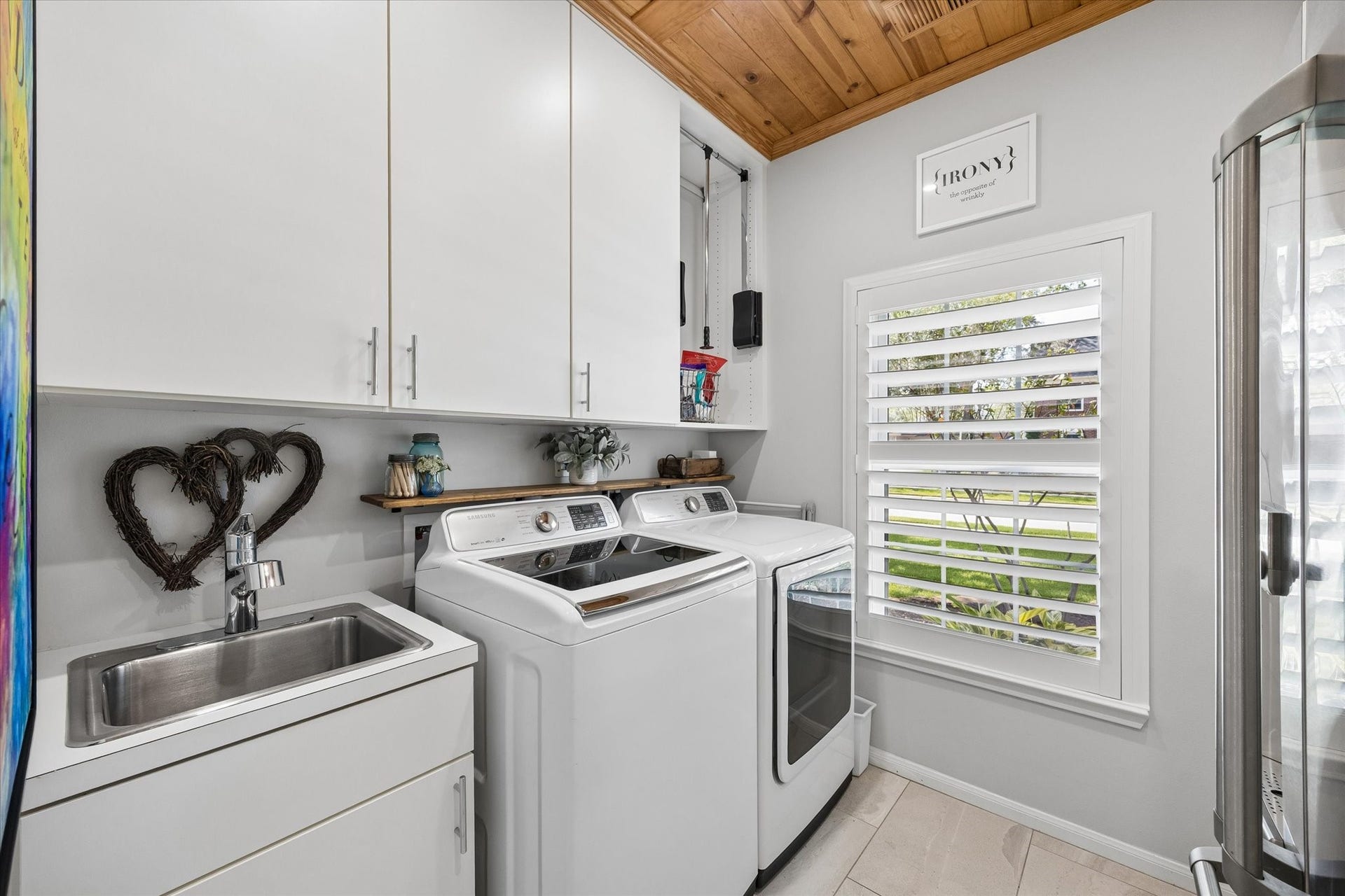 15106 Chestnut Glen Lane, Cypress, TX 77429 Laundry day feels a little easier with generous cabinetry, a utility sink, and a bright, organized space designed to make everyday chores more convenient.