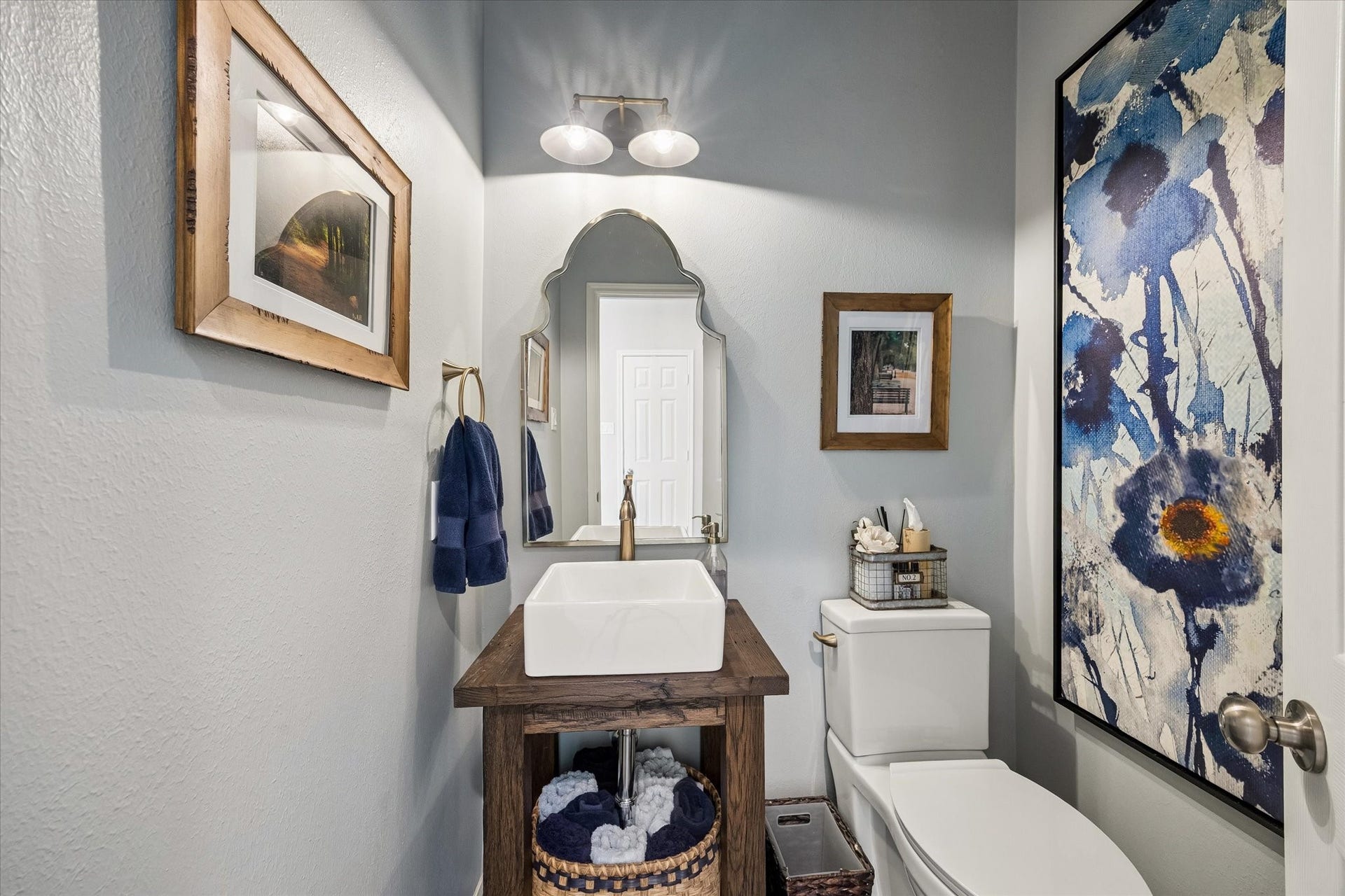 15106 Chestnut Glen Lane, Cypress, TX 77429 A little personality makes all the difference! This beautifully appointed powder room features distinctive finishes and thoughtful details, creating an inviting space for guests while reflecting the custom touches found throughout the home.