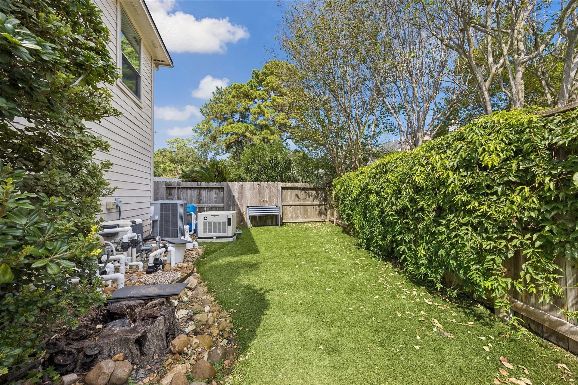 15106 Chestnut Glen Lane, Cypress, TX 77429 There's more to the backyard than the pool! This additional fenced outdoor space features low-maintenance turf and offers flexibility for pets, planting, play, or simply enjoying a little extra room outdoors.