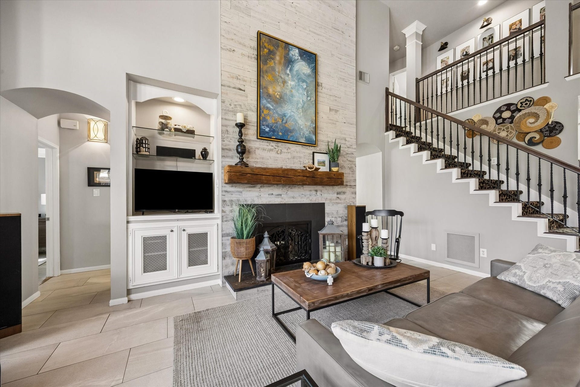 15106 Chestnut Glen Lane, Cypress, TX 77429 Imagine evenings gathered around the fireplace, sharing stories or settling in for a favorite movie. Soaring ceilings, generous seating space, and a beautiful fireplace with a reclaimed wood mantel create a warm and inviting place to unwind.