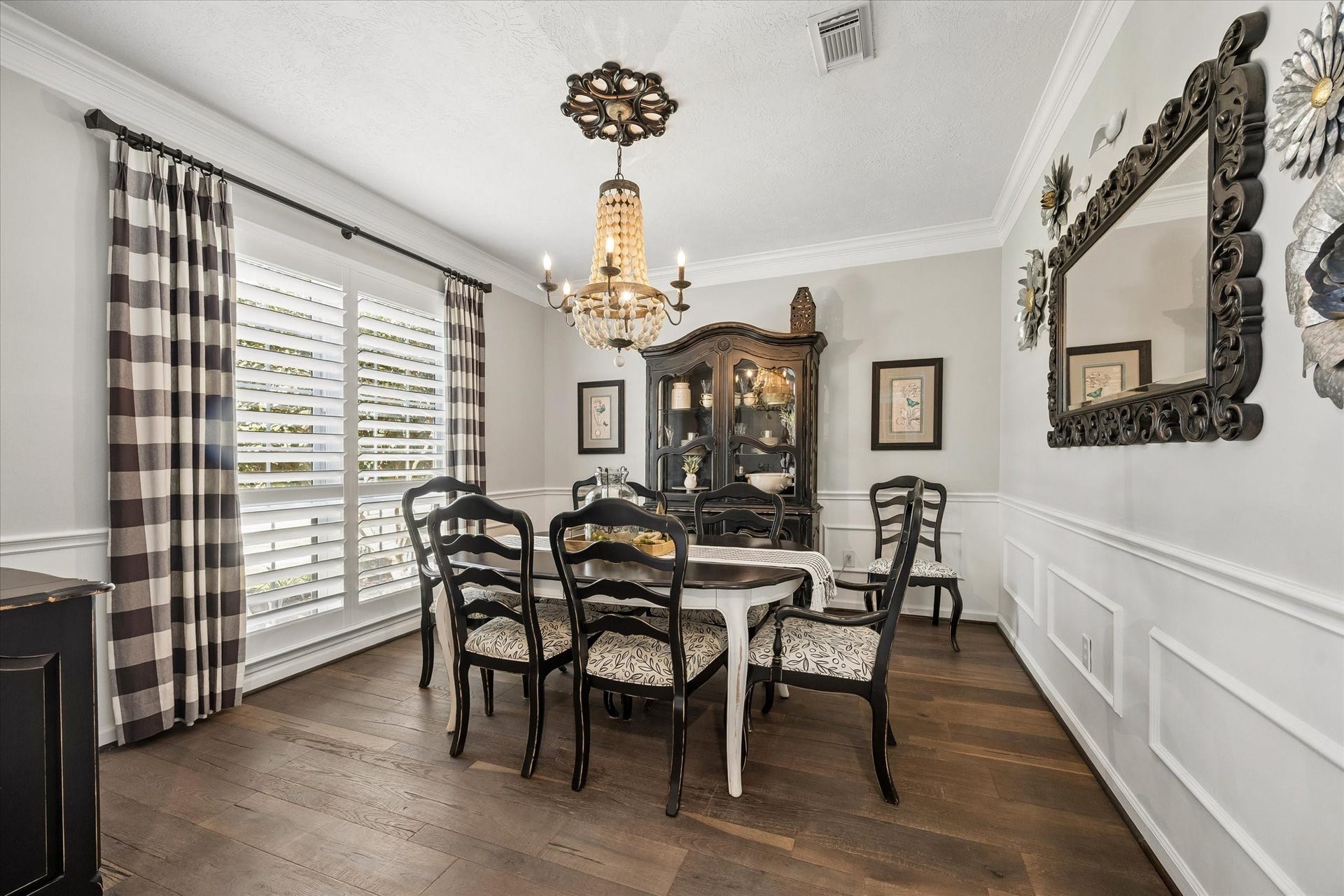 15106 Chestnut Glen Lane, Cypress, TX 77429 From holiday celebrations to intimate dinners with friends, this elegant dining room provides a beautiful setting for gathering around the table. Rich wood flooring, decorative molding, and natural light add warmth and character to every occasion.