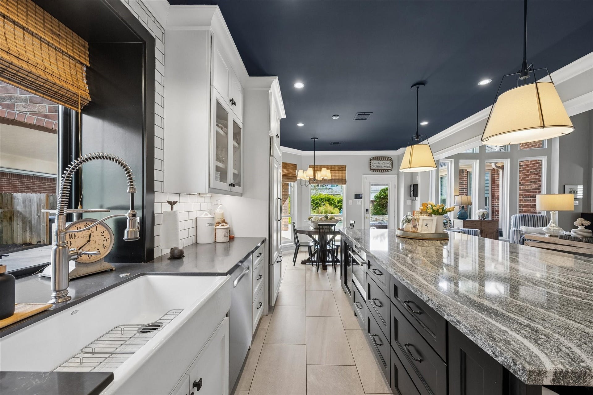 15106 Chestnut Glen Lane, Cypress, TX 77429 A charming farmhouse sink, thoughtfully designed cabinetry and generous counter space create an inviting workspace that combines style, function, and convenience.