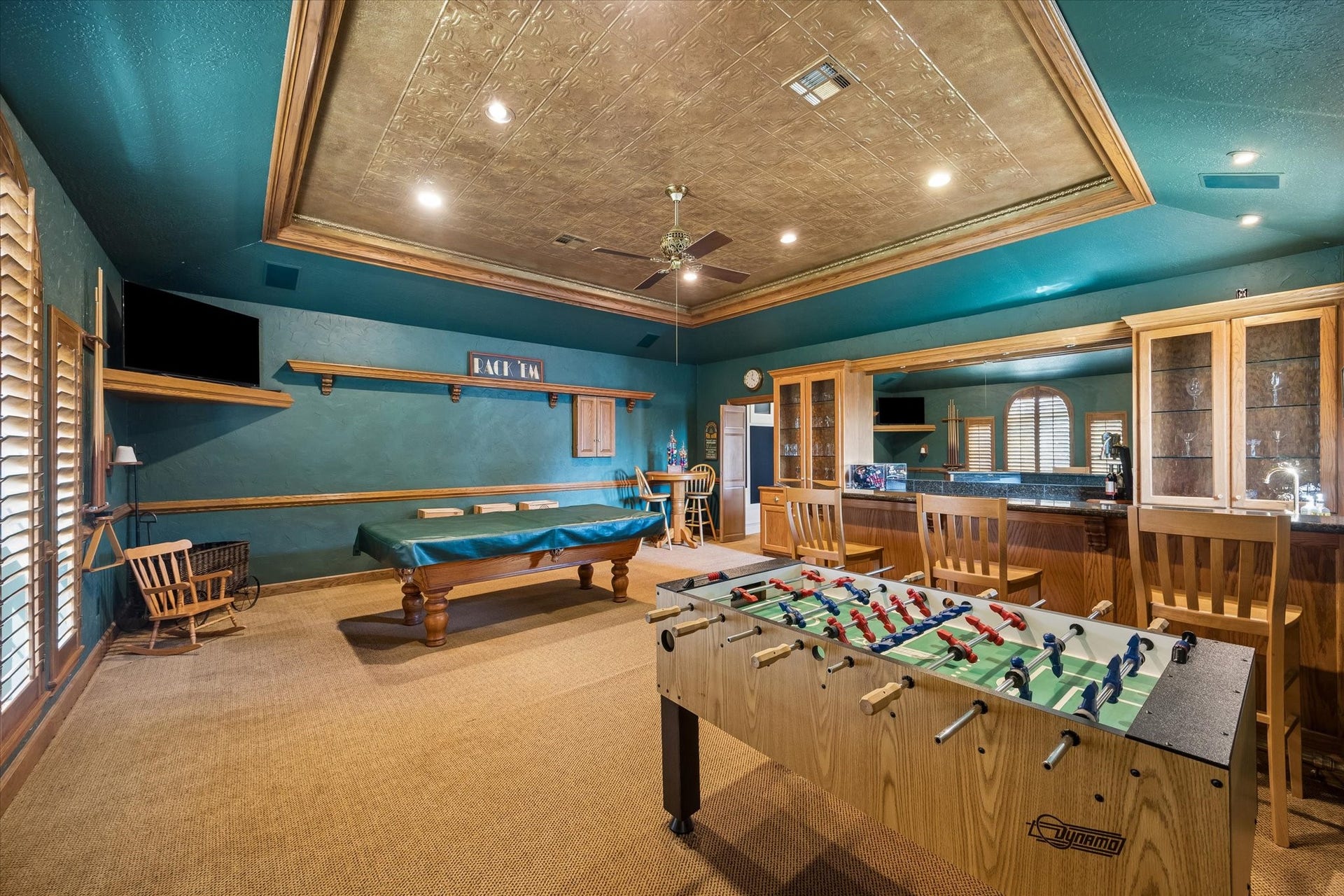15106 Chestnut Glen Lane, Cypress, TX 77429 Imagine Friday nights filled with friendly competition, laughter, and a little rivalry over the pool table. With a foosball table, custom wet bar, and plenty of room to gather, this is the kind of space everyone will gravitate toward. Best of all, both game tables stay with the home!